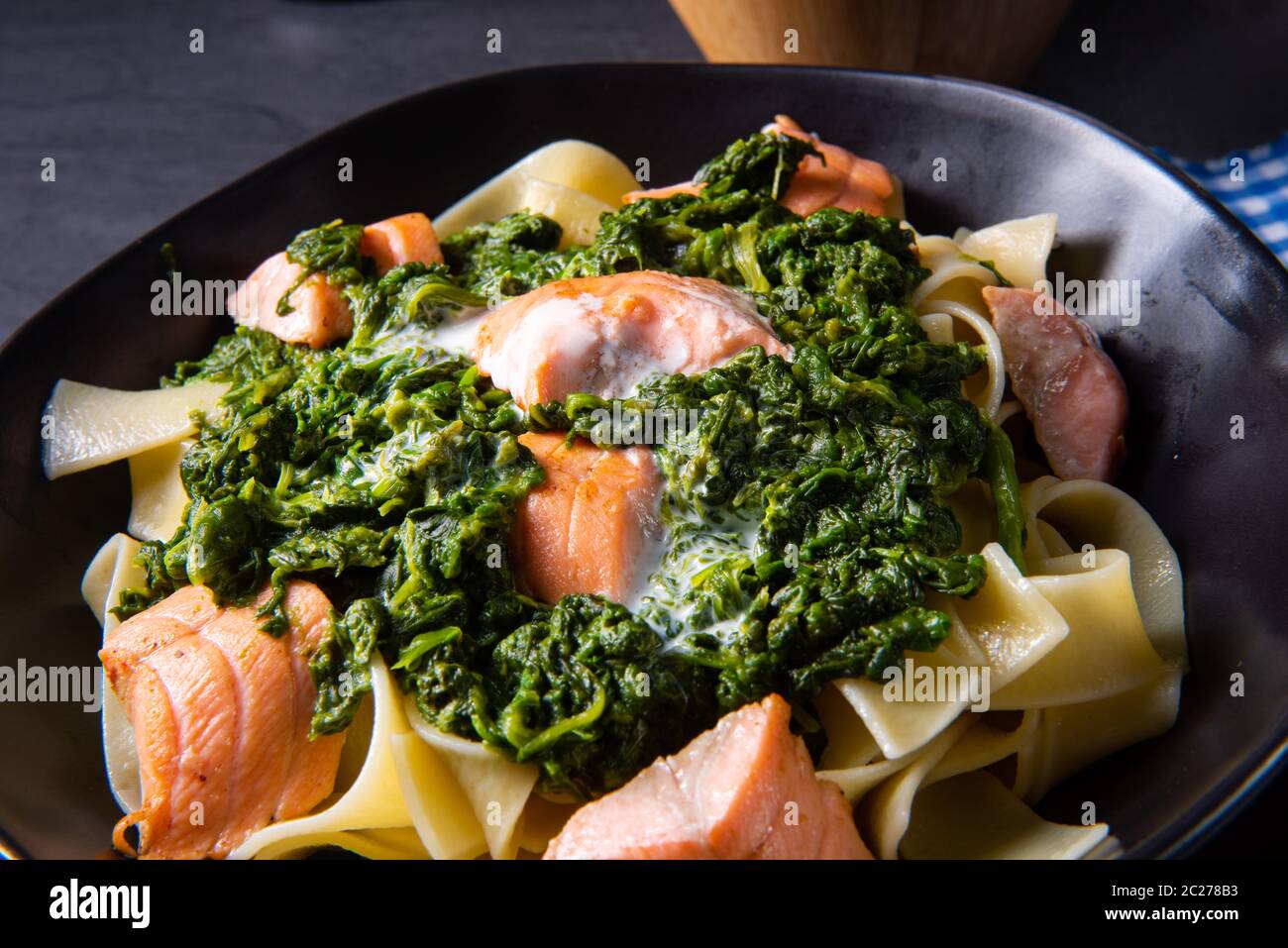 pappardelle pasta with creamed spinach and fried salmon Stock Photo Alamy