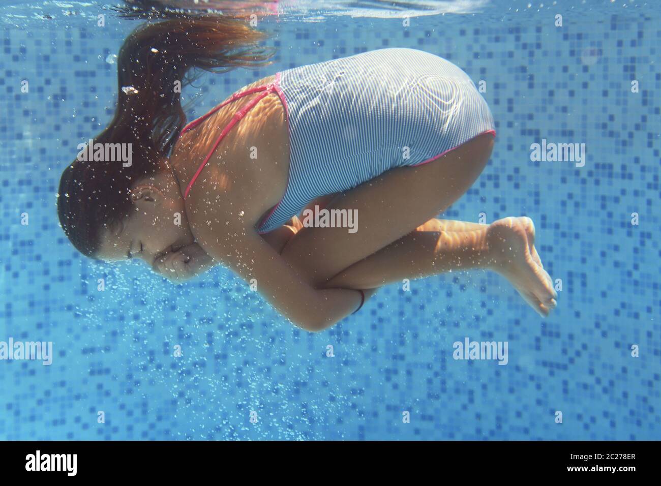 Little girl swimming underwater Stock Photo Alamy