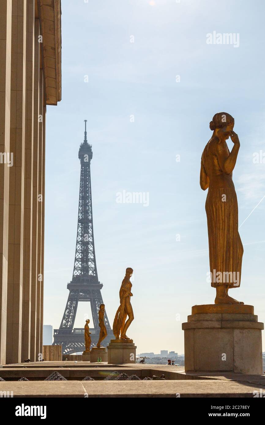 Paris, France, March 27 2017: Row of golden statues, Place du Trocadero in city Paris,on a summer morning, in front of the Eiffe Stock Photo