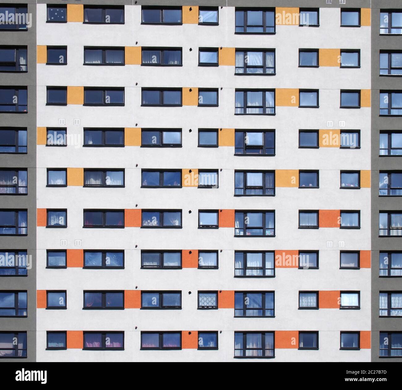 Image showcasing a full frame image of windows in a large high rise apartment building ...