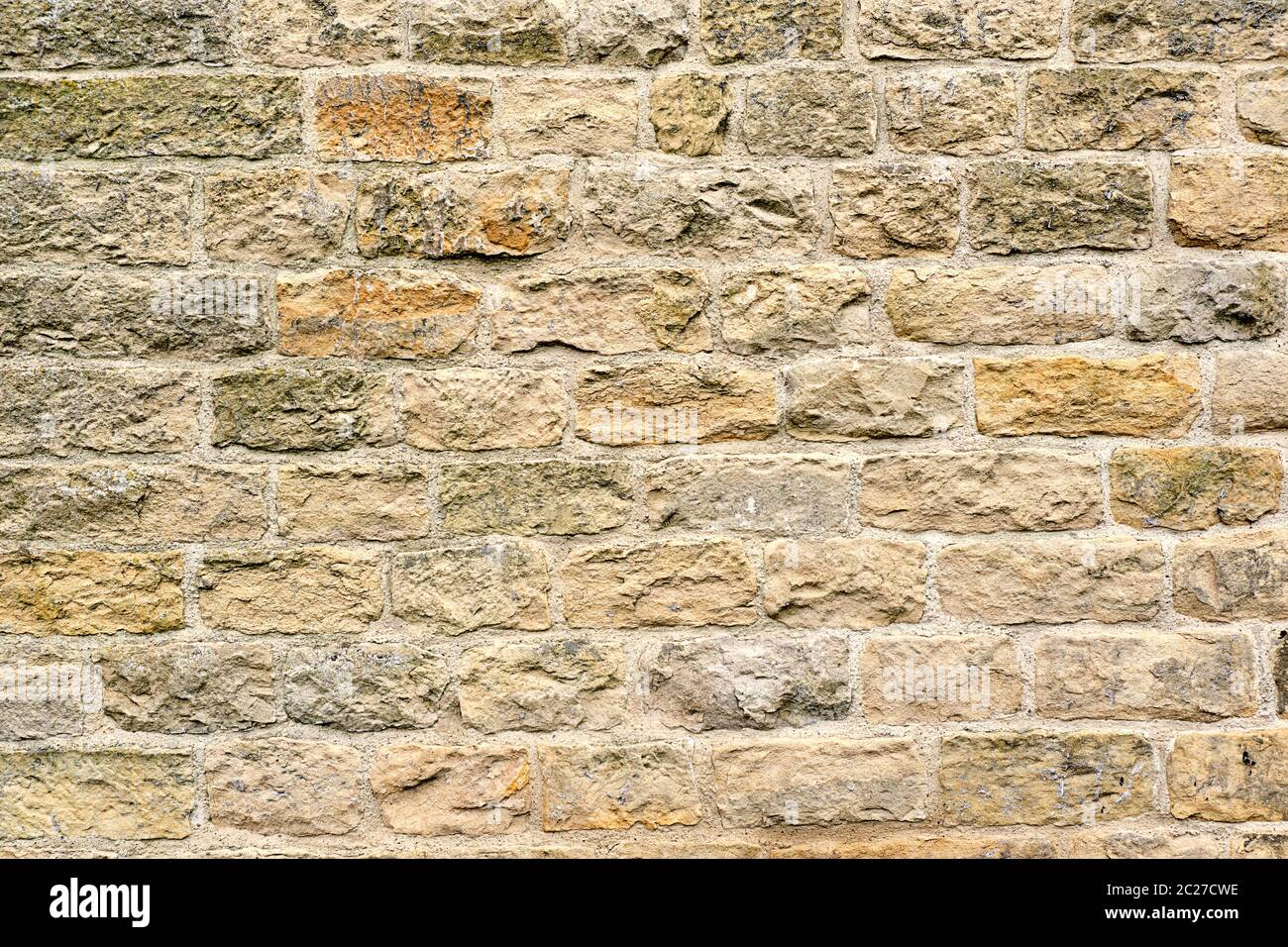 Background from a beige natural stone wall Stock Photo