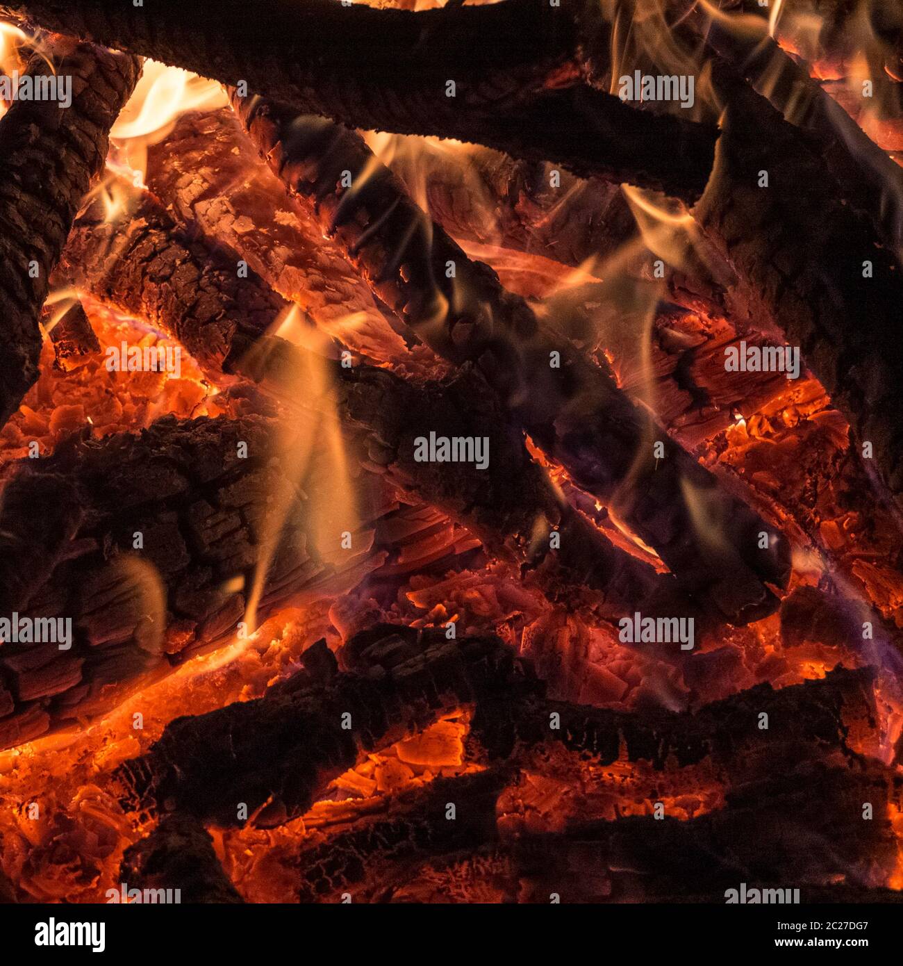 Hot campfire place full of crackling fire wood Stock Photo Alamy