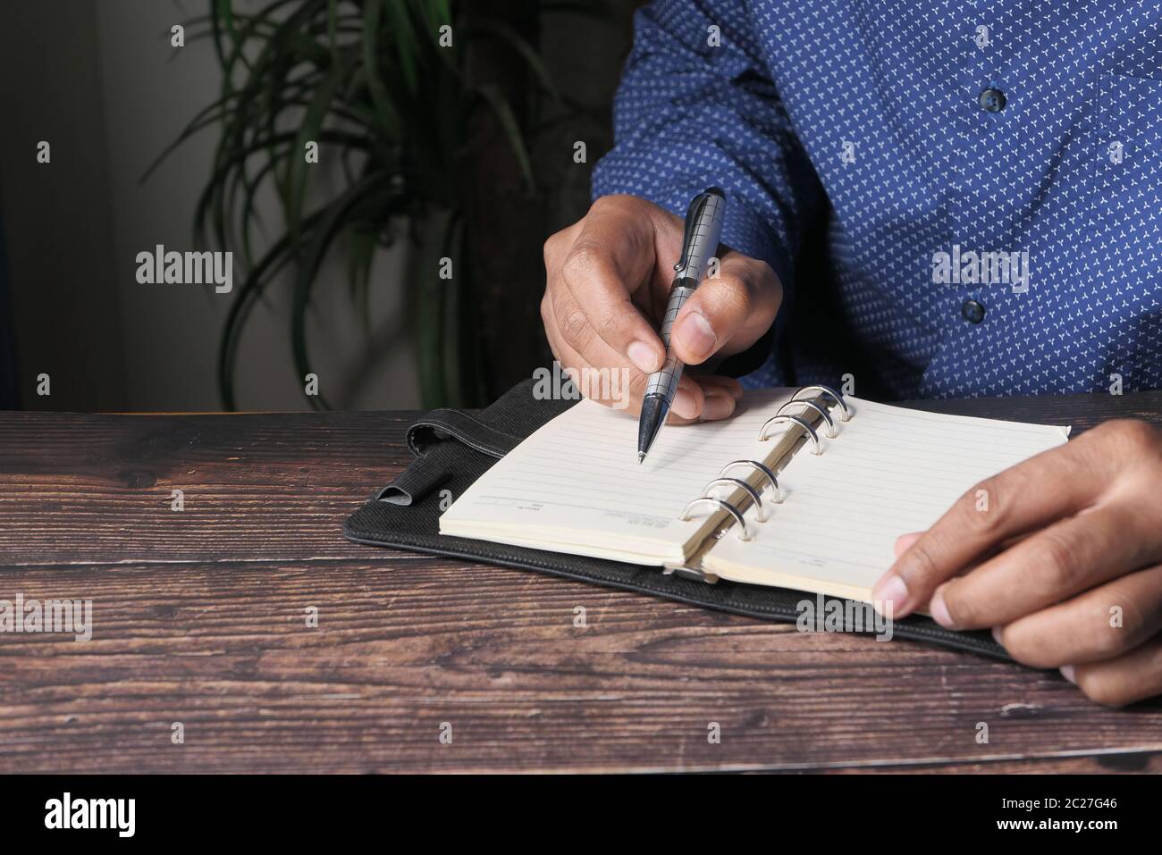 person hand writing on paper, close up  Stock Photo