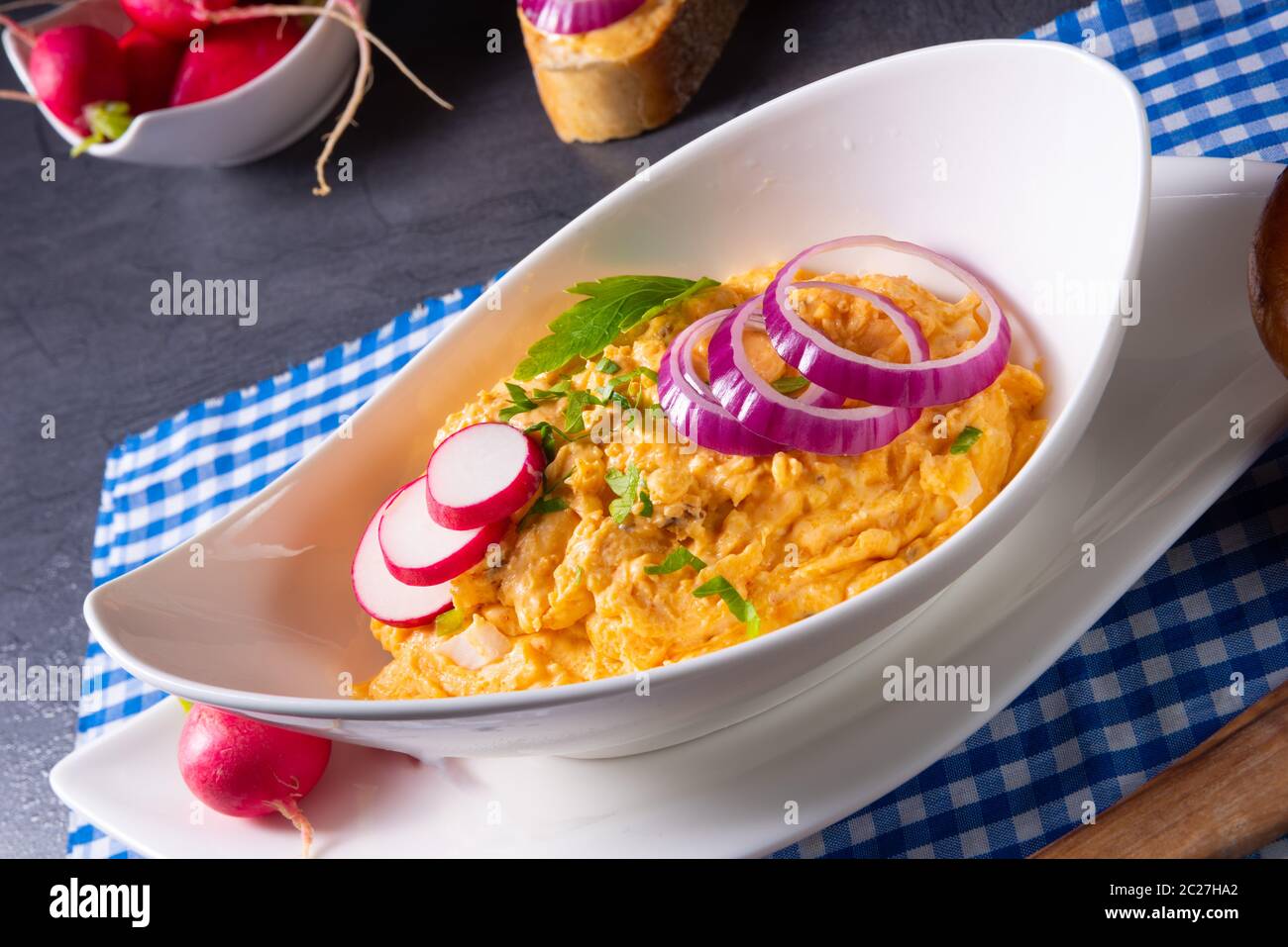 The perfect Bavarian obazda with radishes and onions Stock Photo