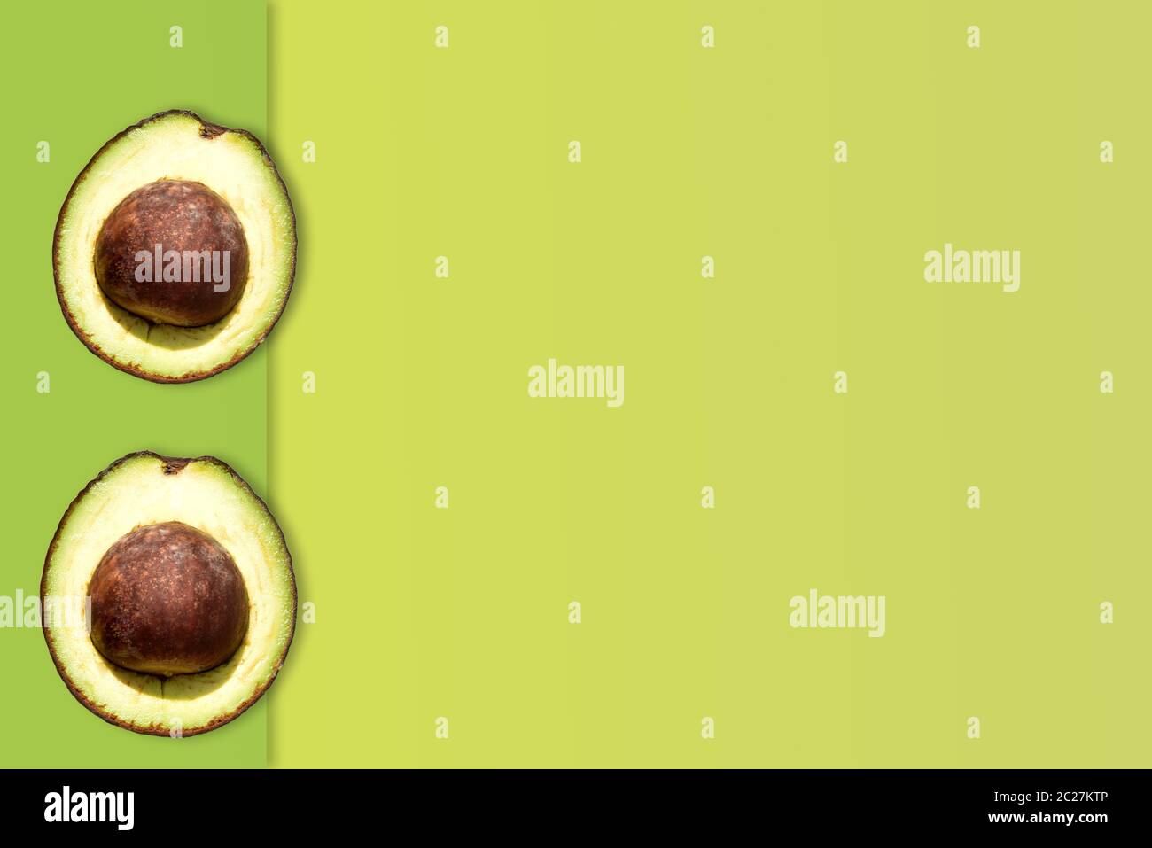 Creative layout made of avocado on the green background. Flat lay. Food ...