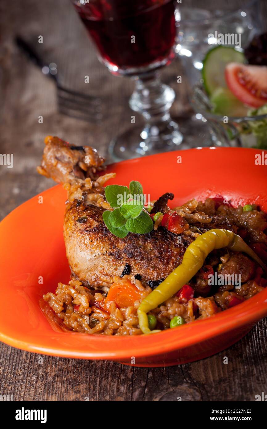 grilled chicken leg on rice with chillie Stock Photo