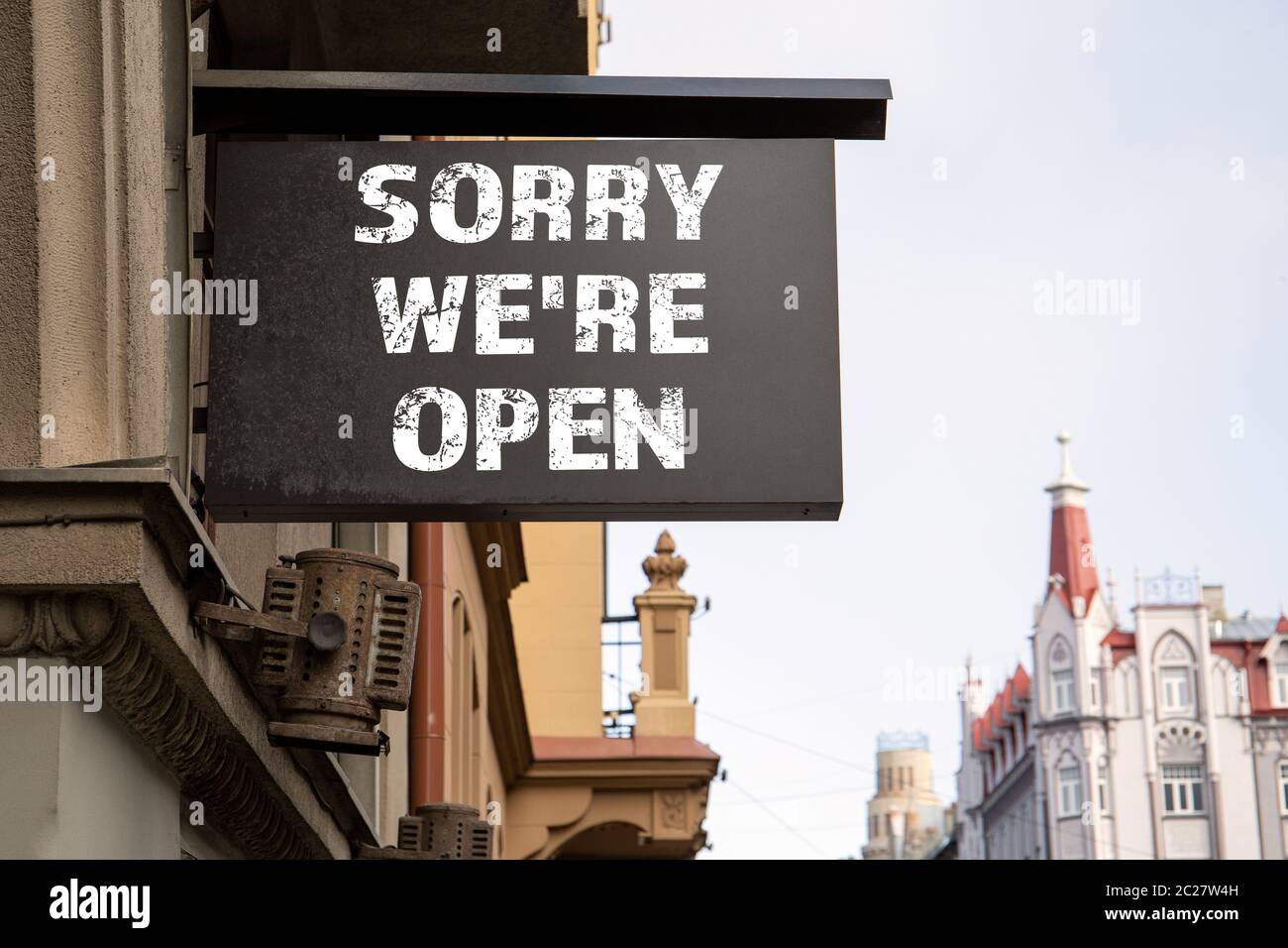 SORRY WERE OPEN. Shop, cafe, restaurant or hotel signboard. City center and old town. Urban environment Stock Photo