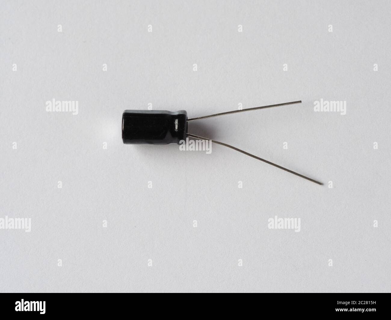 capacitor (aka condenser or condensator) device that stores electrical