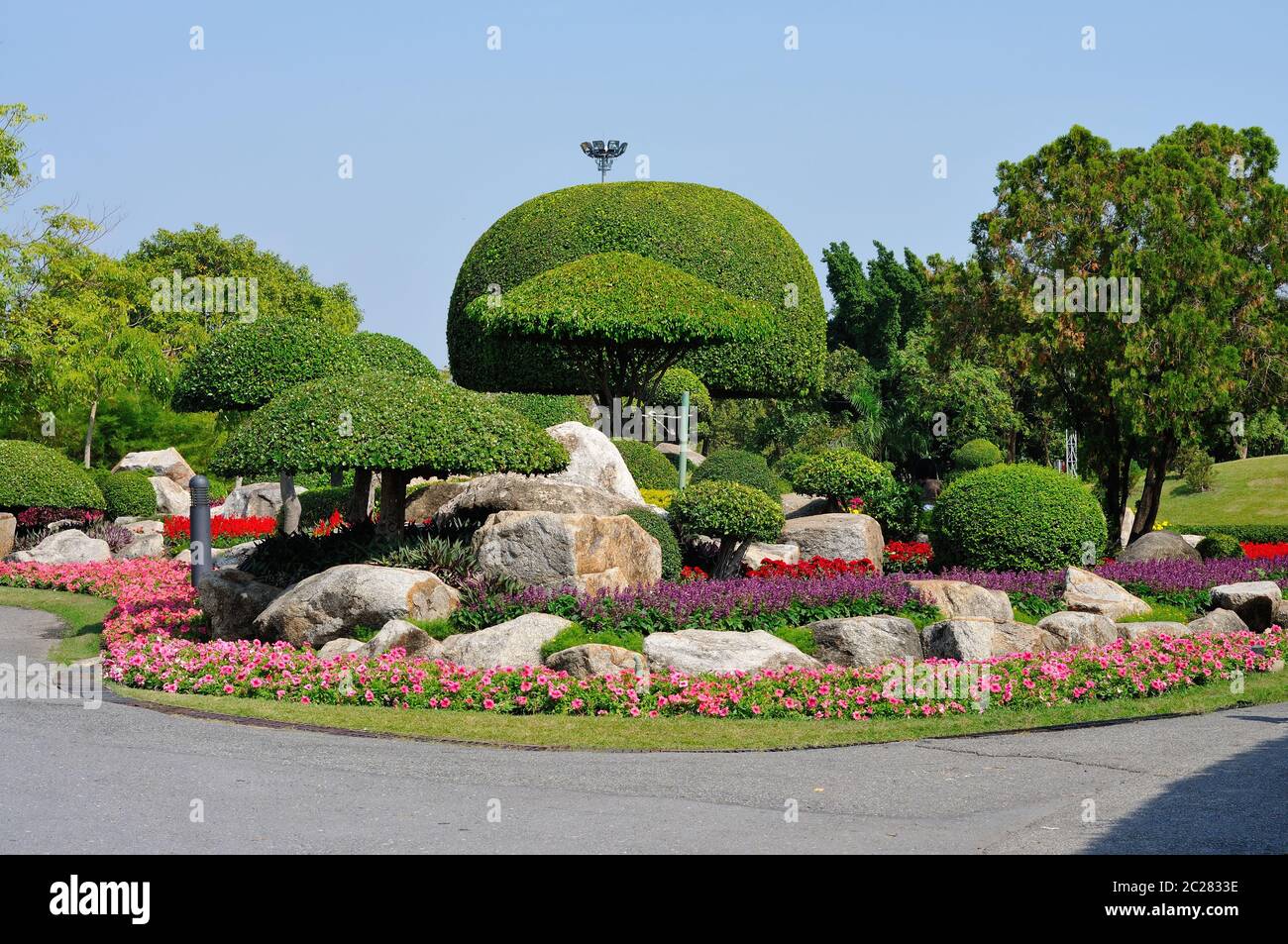 A Very Well maintained Park with Lovely Plants and Flowers Stock Photo