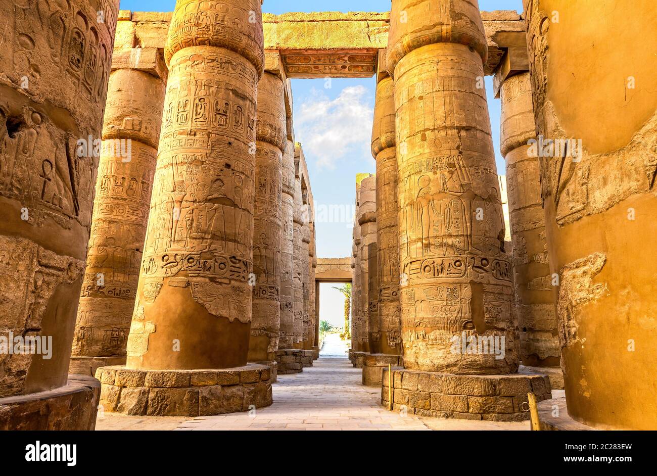 Central colonnade of Karnak temple in Luxor at sunrise, Egypt Stock Photo