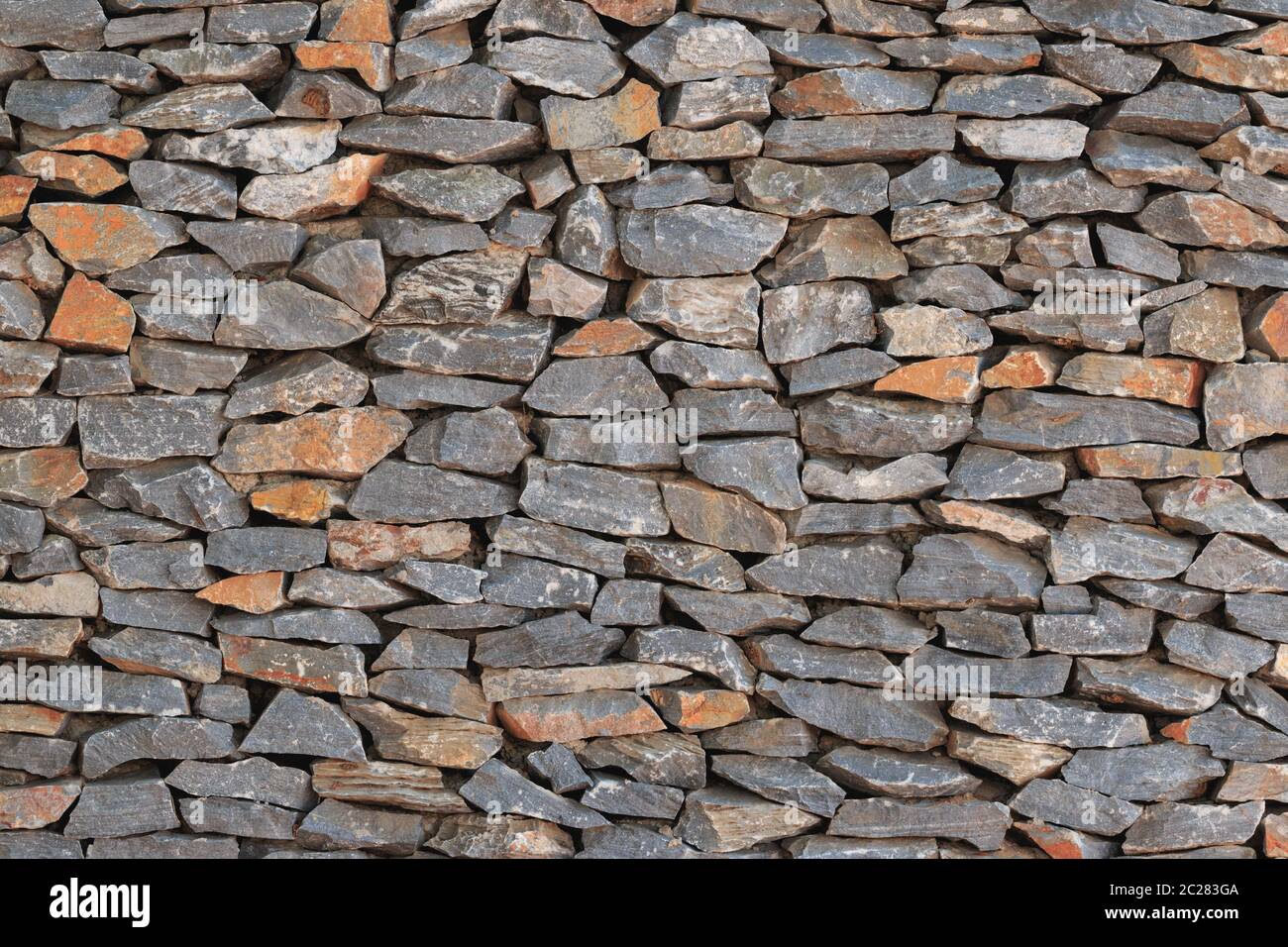 real stone wall surface with cement Stock Photo Alamy