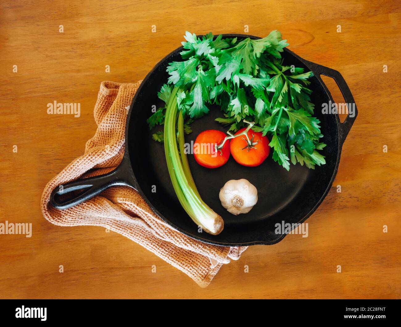 Vegetables in a cast iron pan Stock Photo