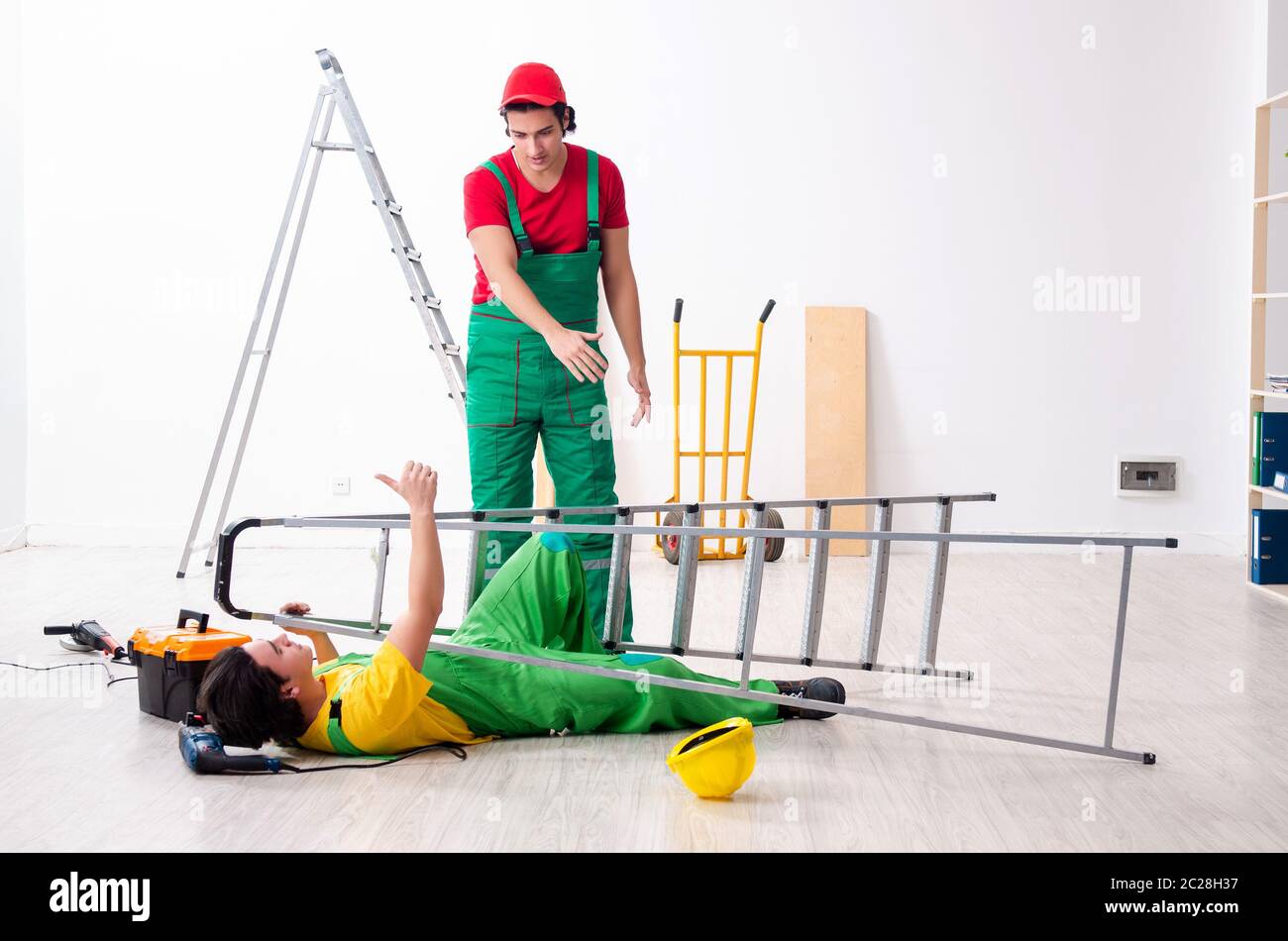 Injured worker and his workmate Stock Photo