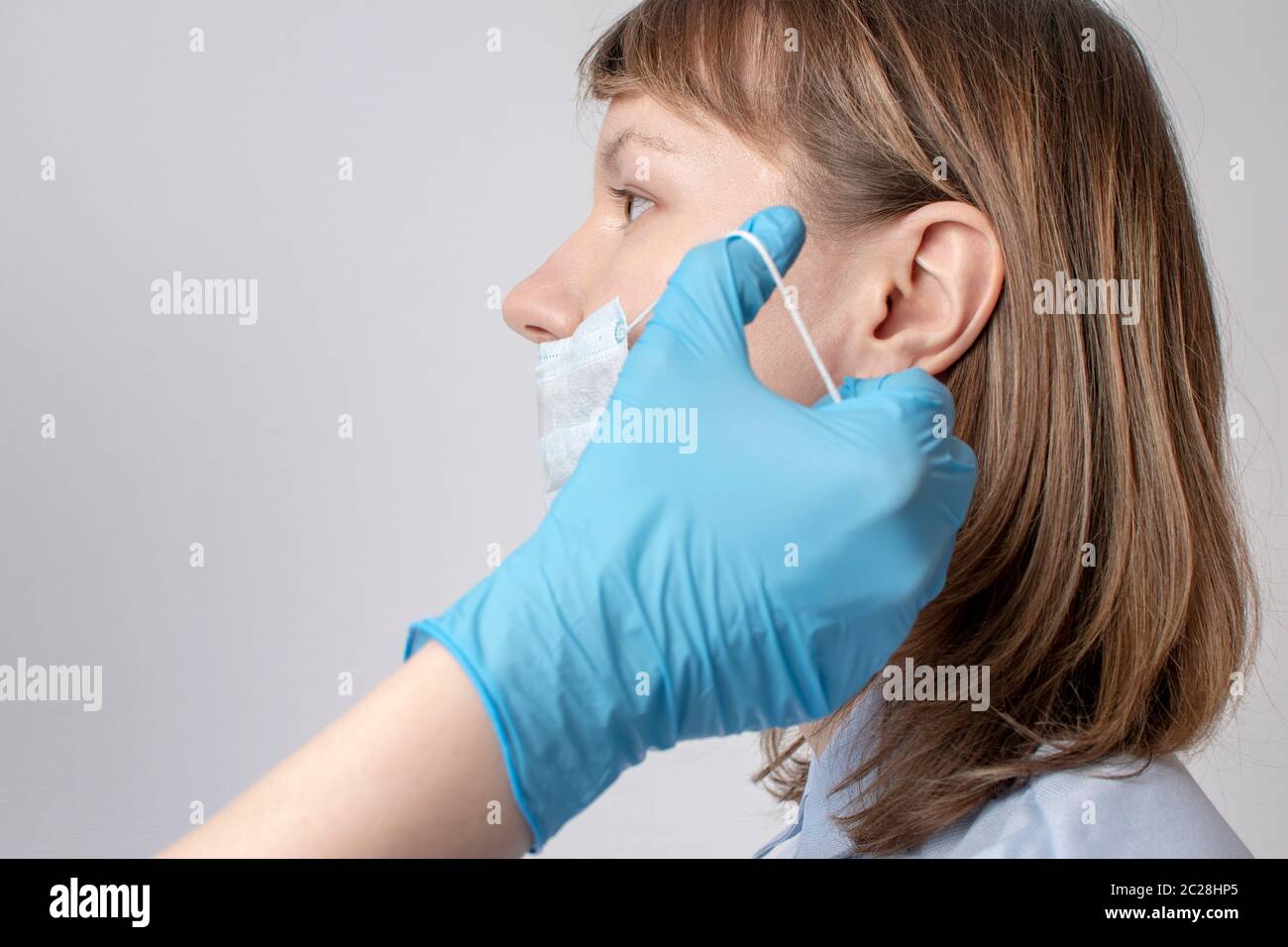 Professional puts face mask woman hi-res stock photography and images ...