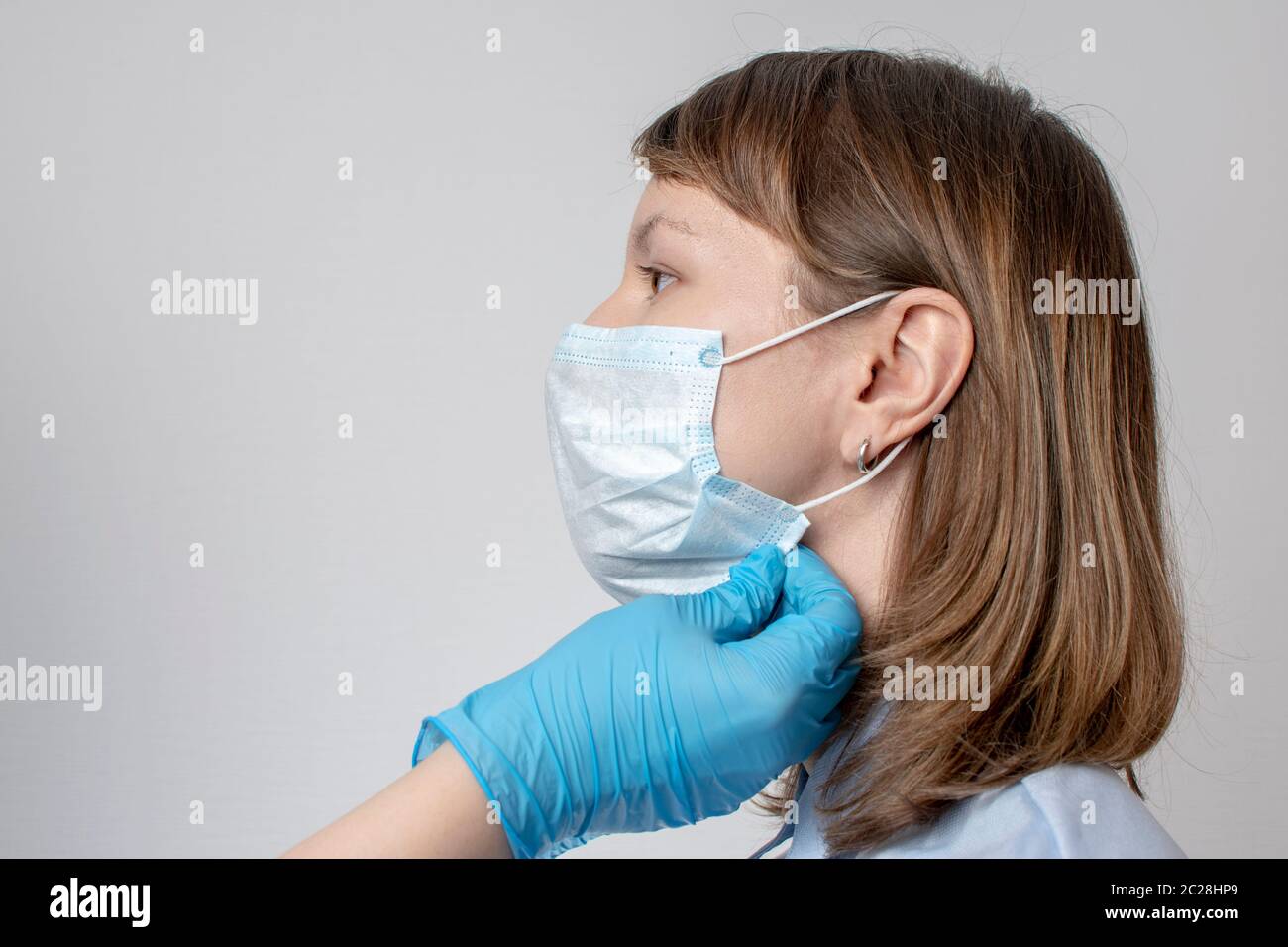 Professional puts face mask woman hi-res stock photography and images ...