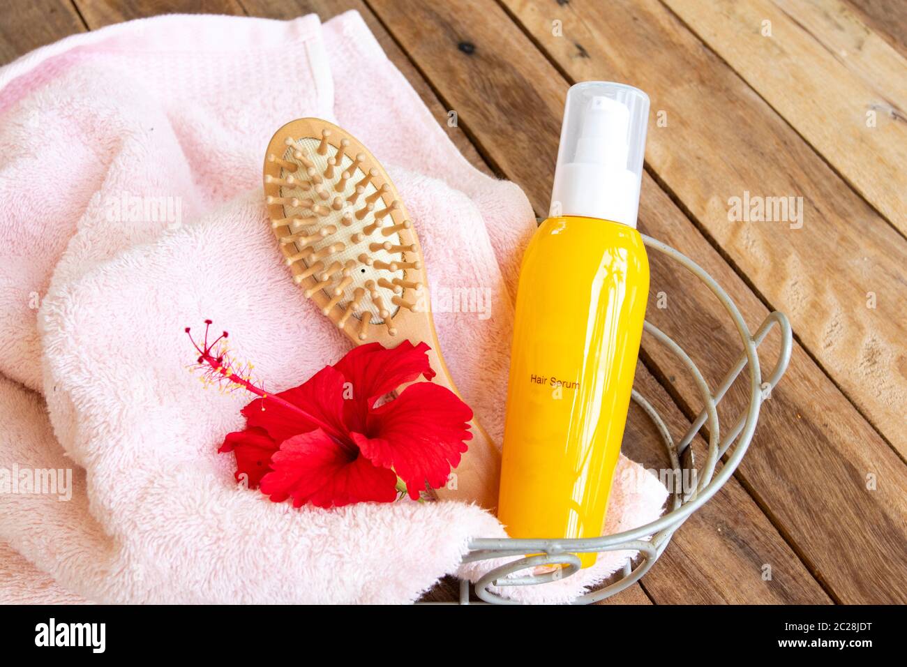 hair care serum for damaged hairs with comb health care beauty head and hairs with terry cloth in basket of lifestyle woman arrangement flat lay style Stock Photo