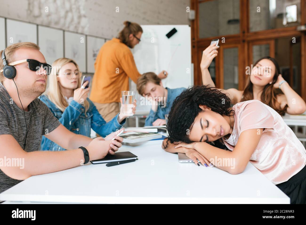 Student Pretending Not To Listen To His Teacher Standing Near Him Stock  Image - Image of classroom, discussion: 139587523