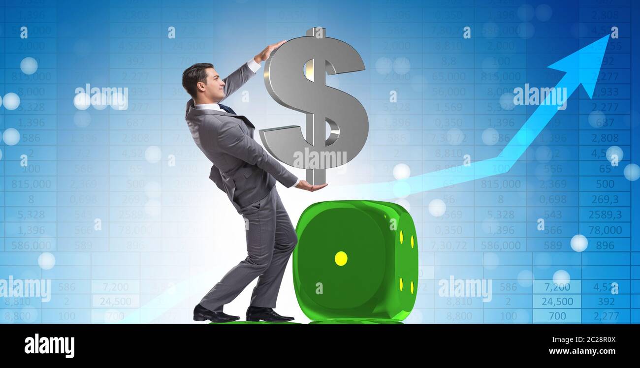 Businessman holding dollar sign on top of dice pyramid Stock Photo - Alamy