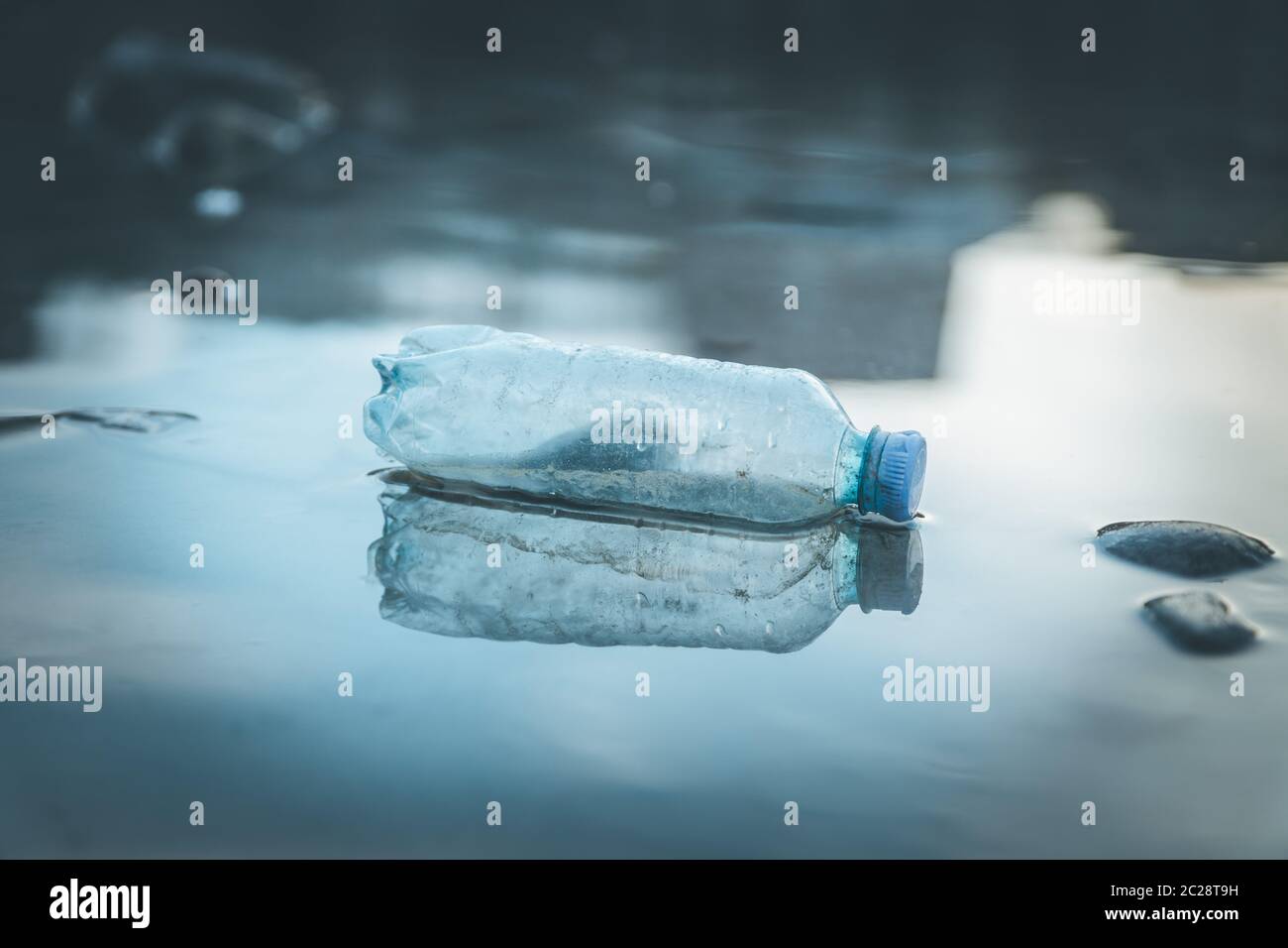 Environmental pollution: plastic bottle on the beach Stock Photo