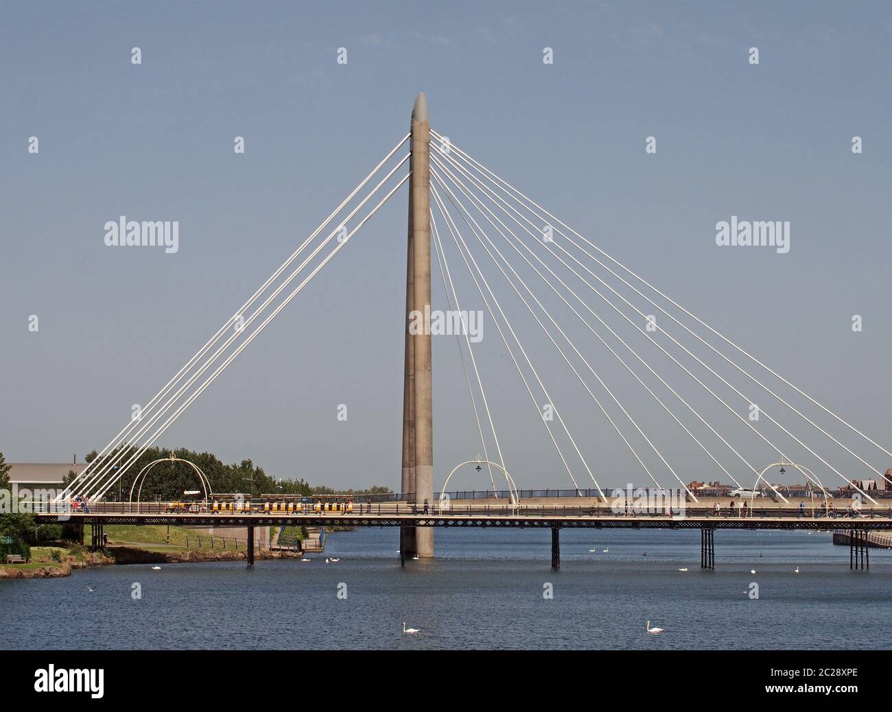 the suspension bridge and pier crossing the lake in kings gardens