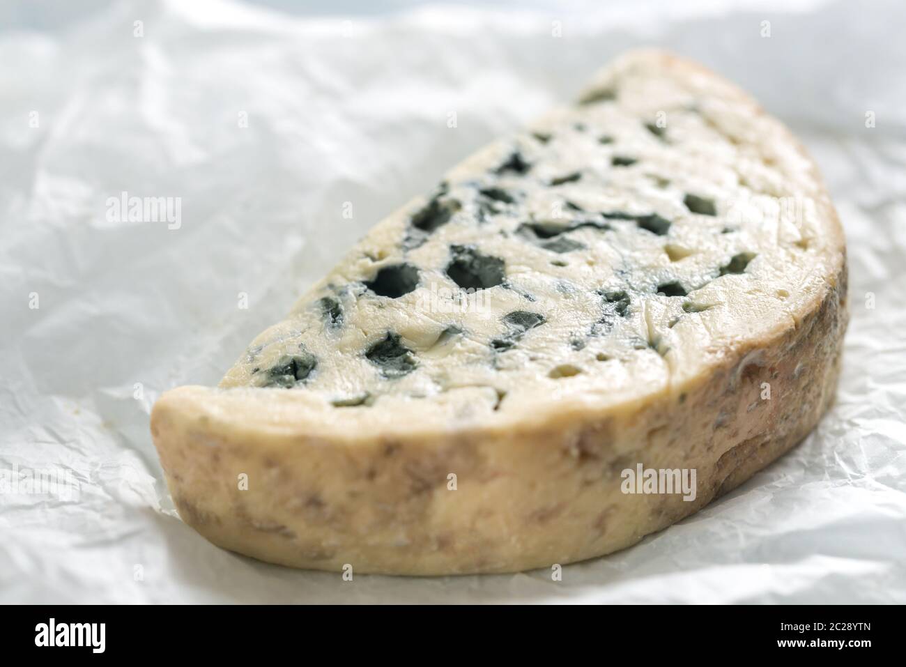 Blue cheese on the white paper Stock Photo