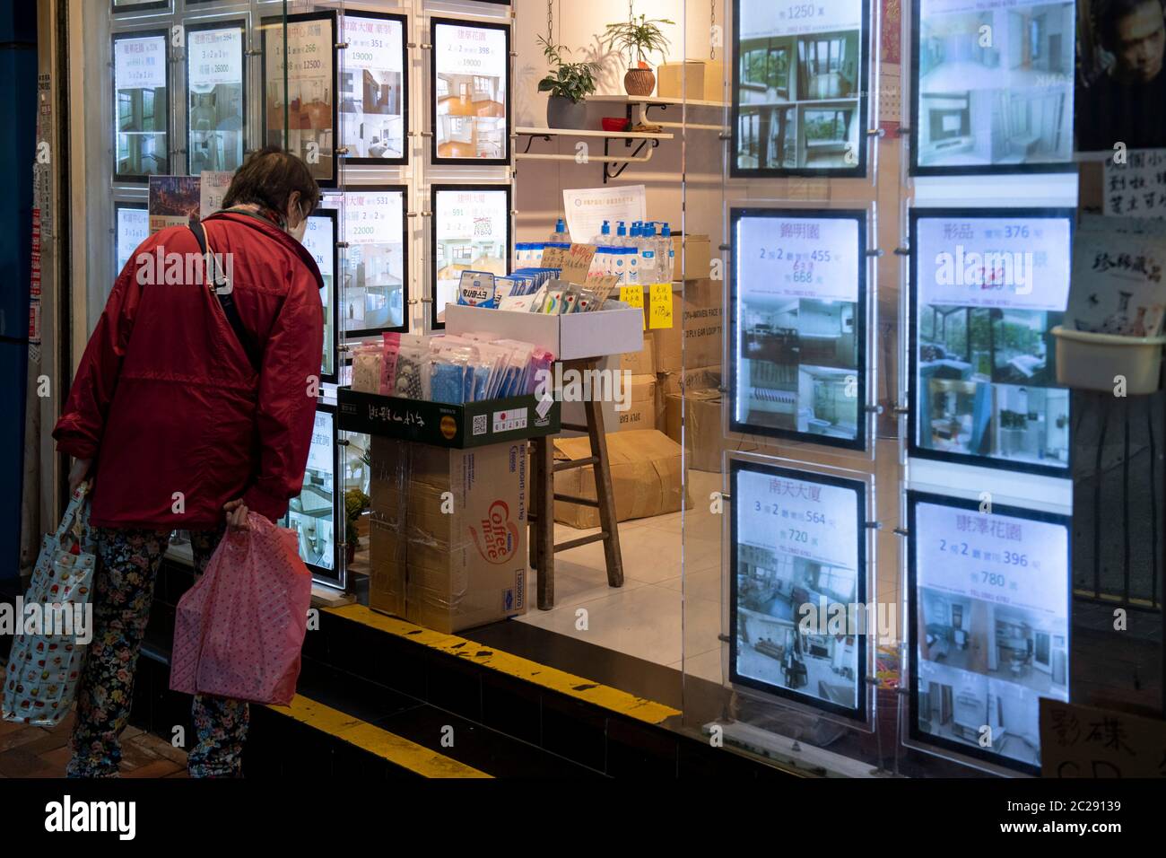 HONG KONG,HONG KONG SAR,CHINA: FEBRUARY 17th 2020.  In tough times, a real estate agent with little work turns to the more lucrative business of selli Stock Photo