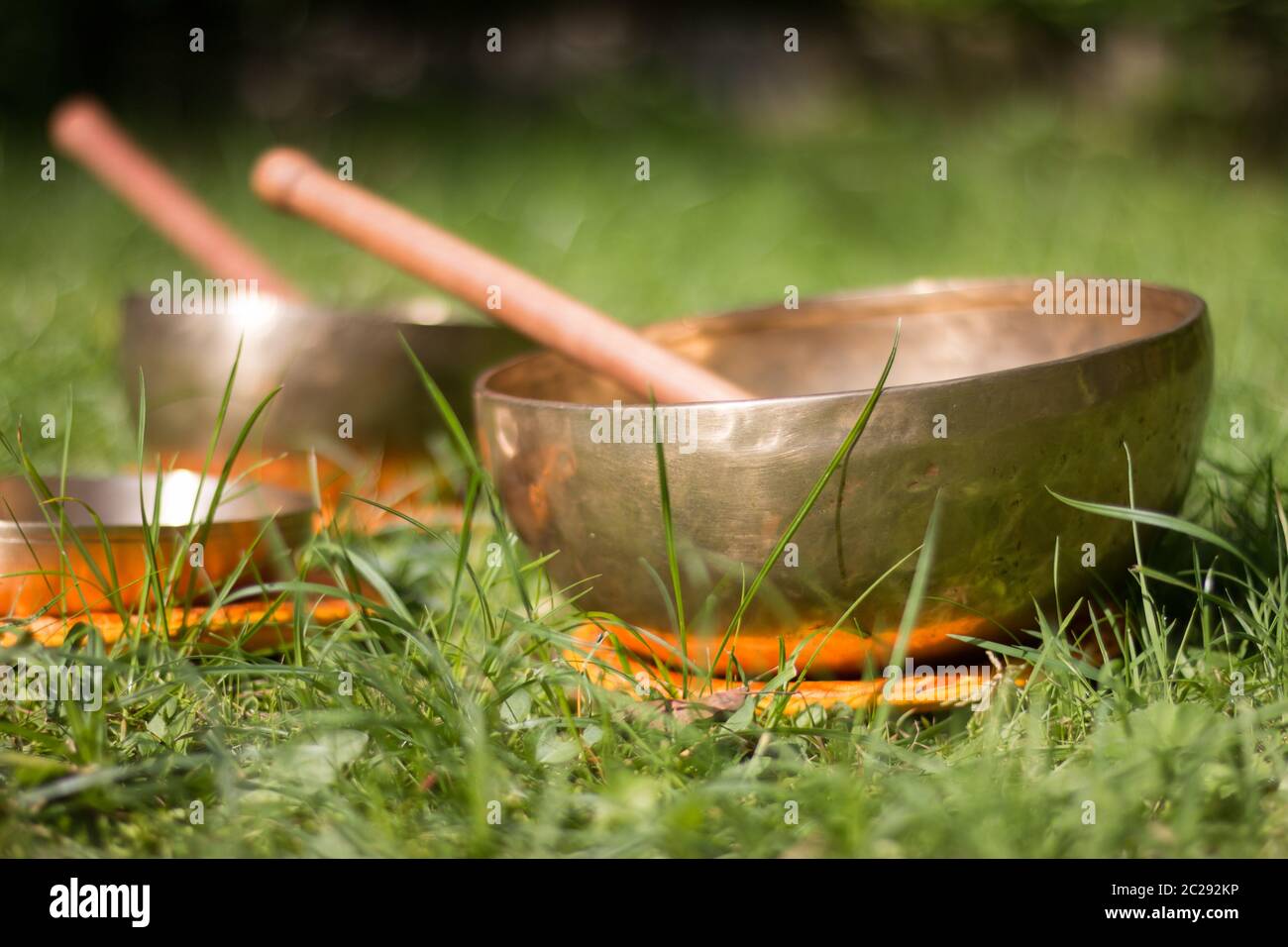 Set of singing bowls in the own garden, zen outdoors Stock Photo
