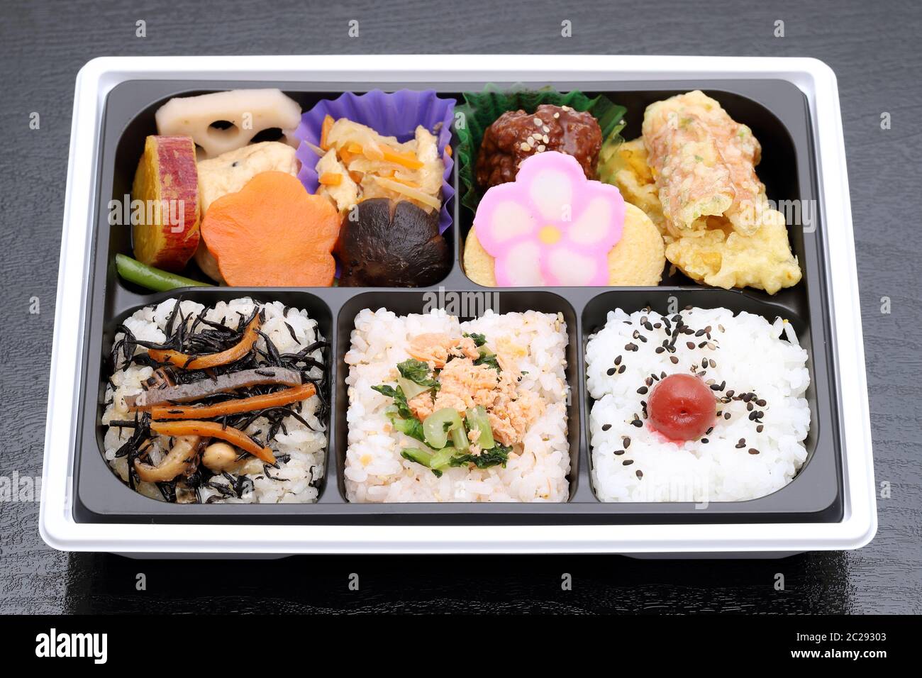 Japanese Makunouchi bento lunch on a black background Stock Photo