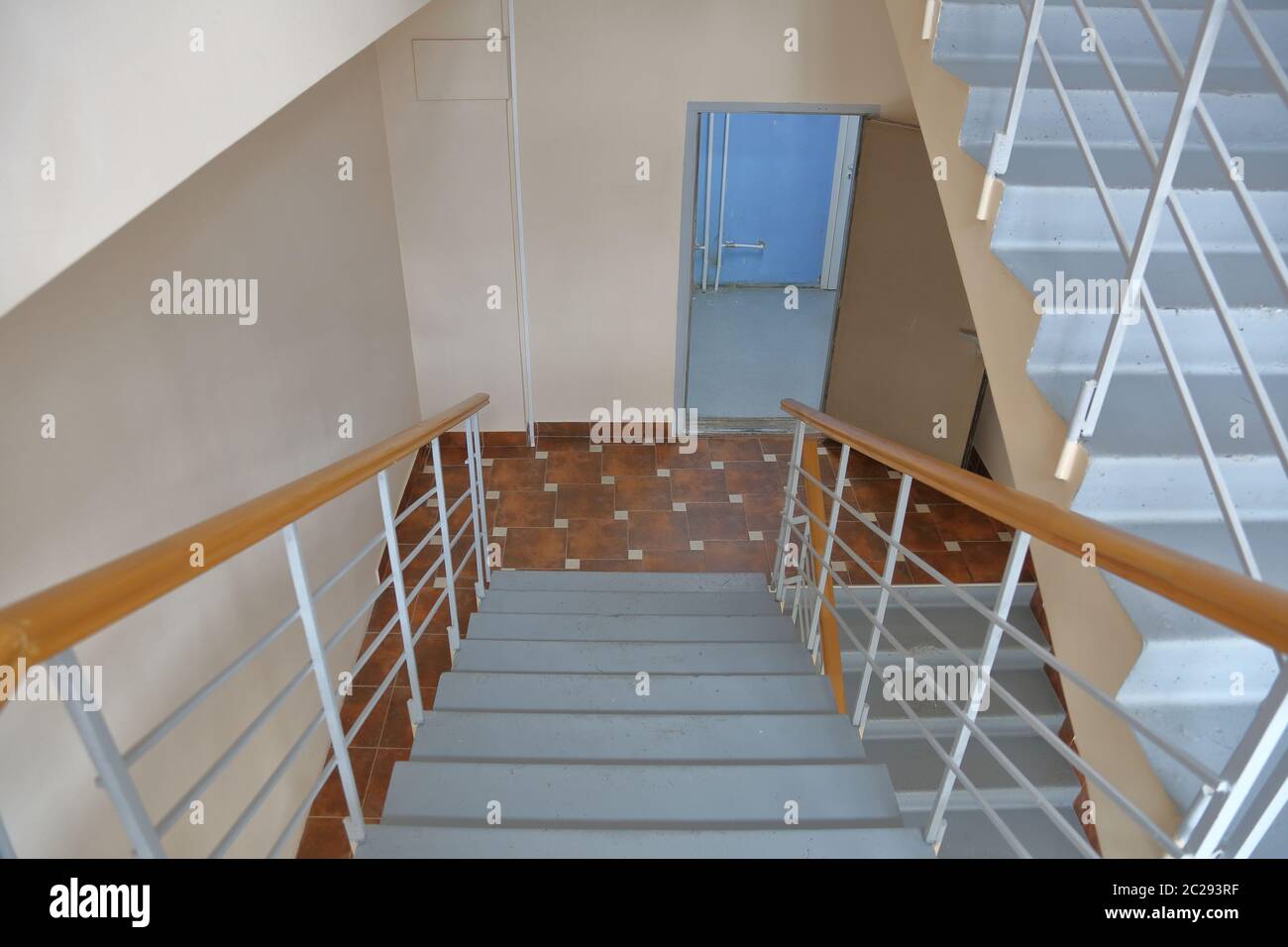 Staircase between floors in an empty office building Stock Photo