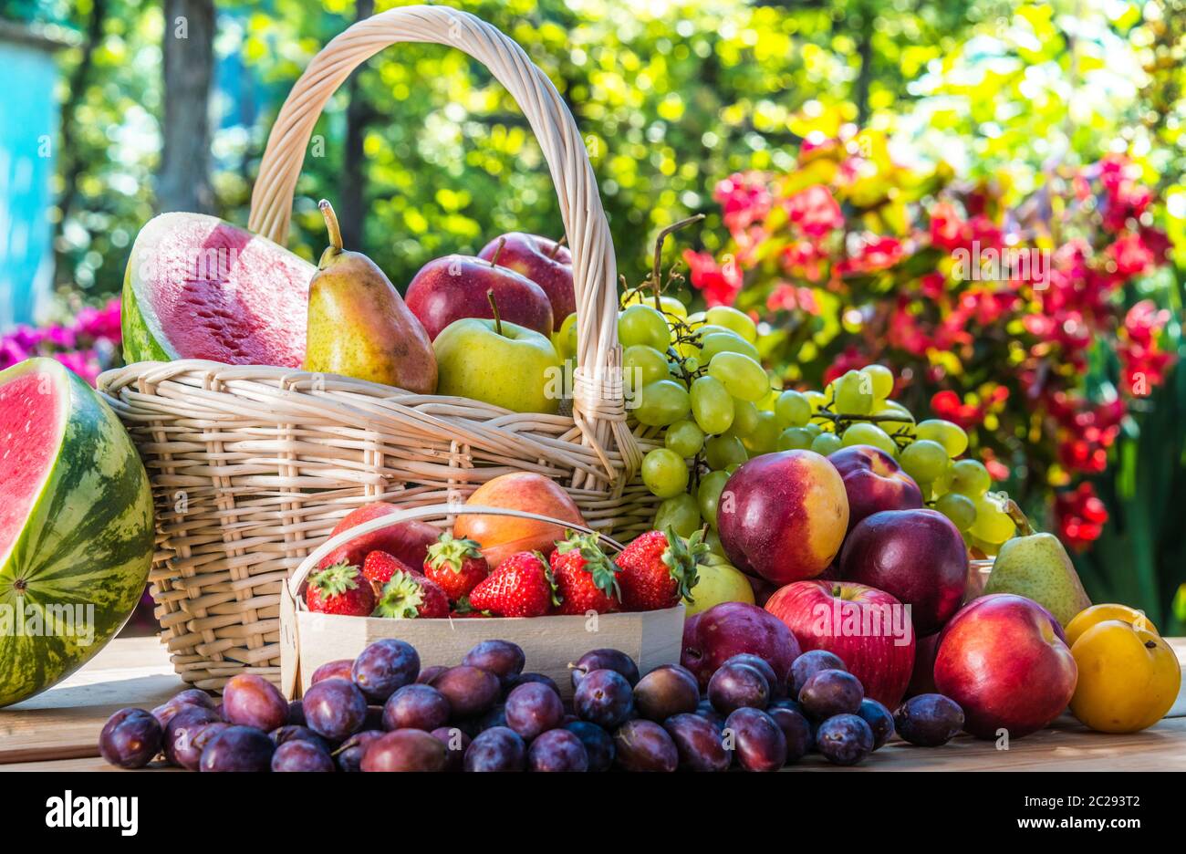 Variety of fresh ripe fruits in the garden. Balanced diet Stock Photo ...