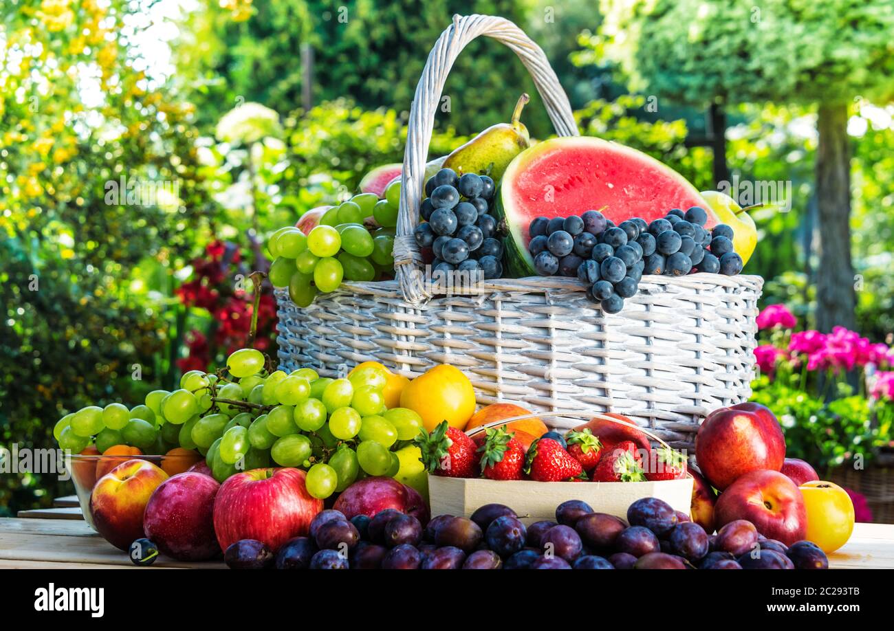 Variety of fresh ripe fruits in the garden. Balanced diet Stock Photo ...
