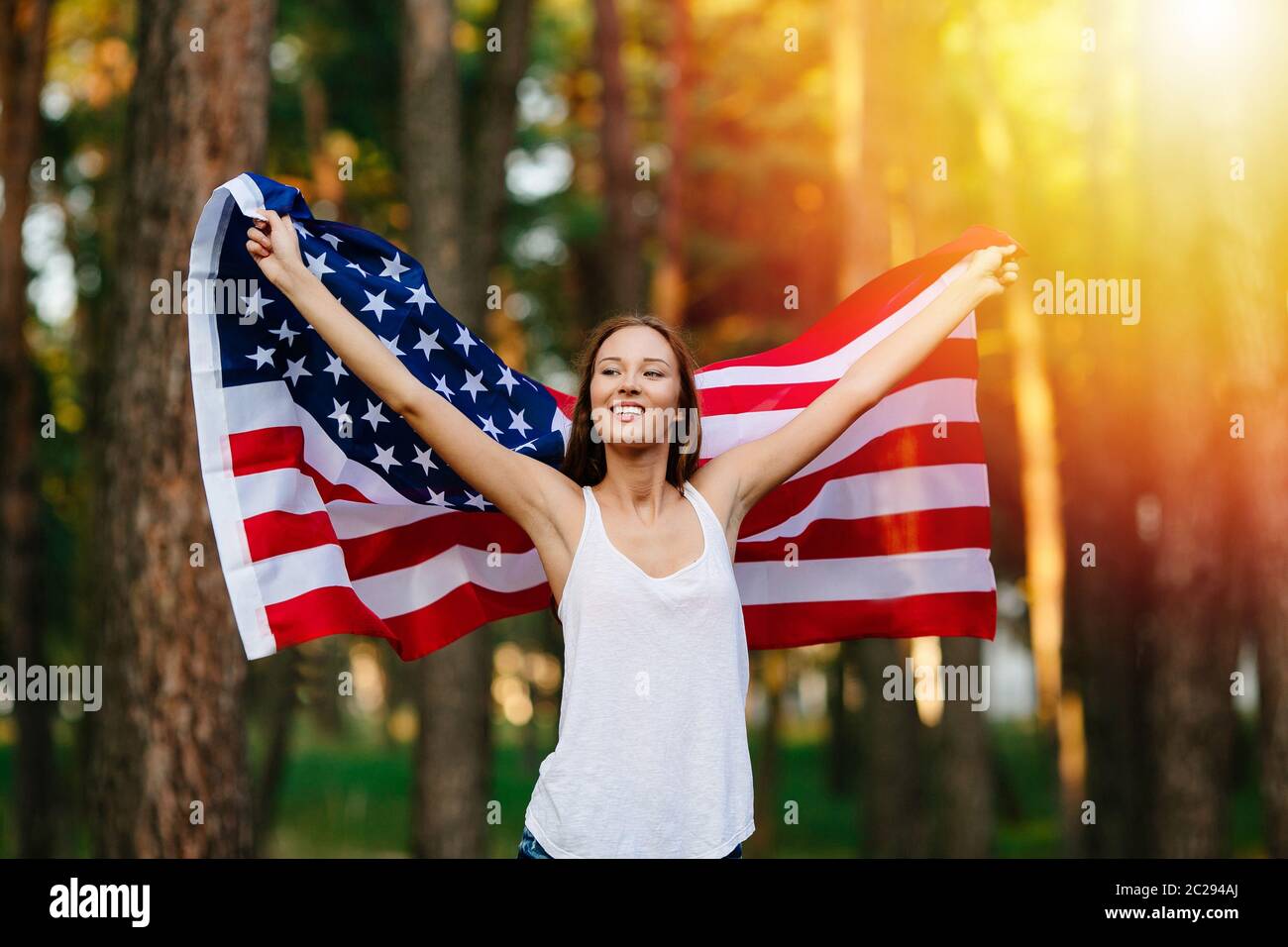 Girl waving American flag Stock Photo - Alamy