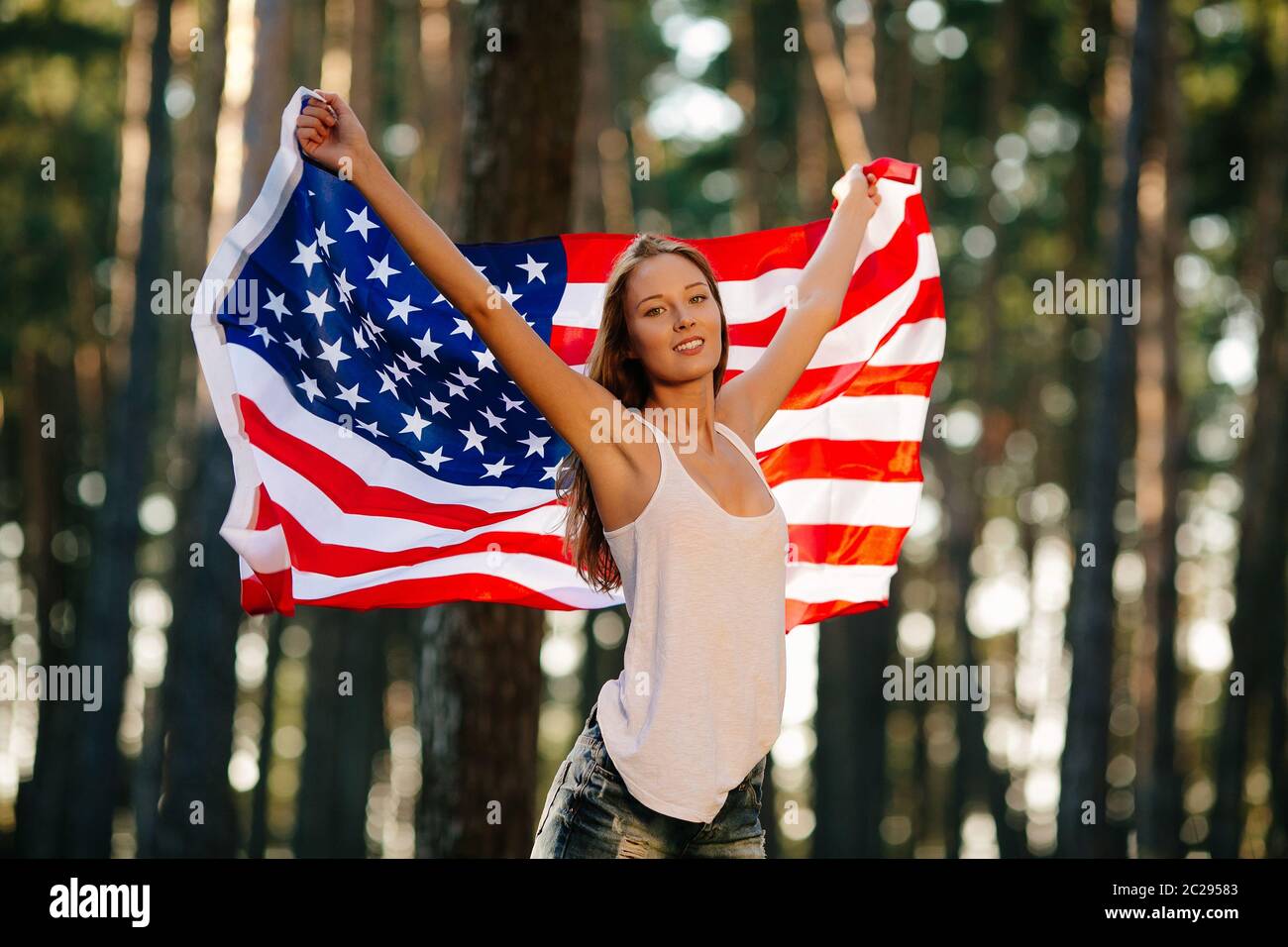 Girl waving American flag Stock Photo - Alamy