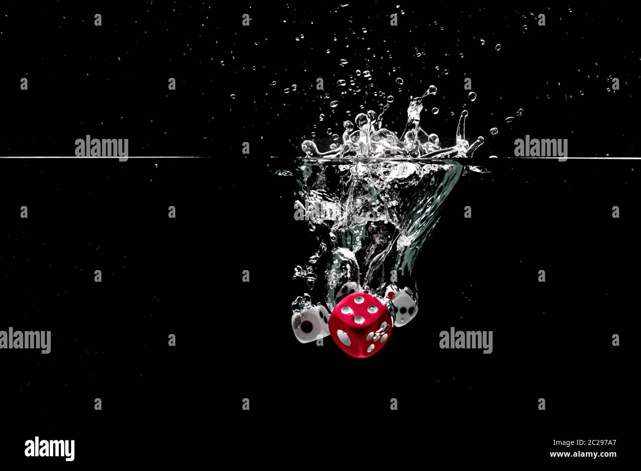 Ludo dice in water splash on black background with lots of air bubbles  Stock Photo - Alamy