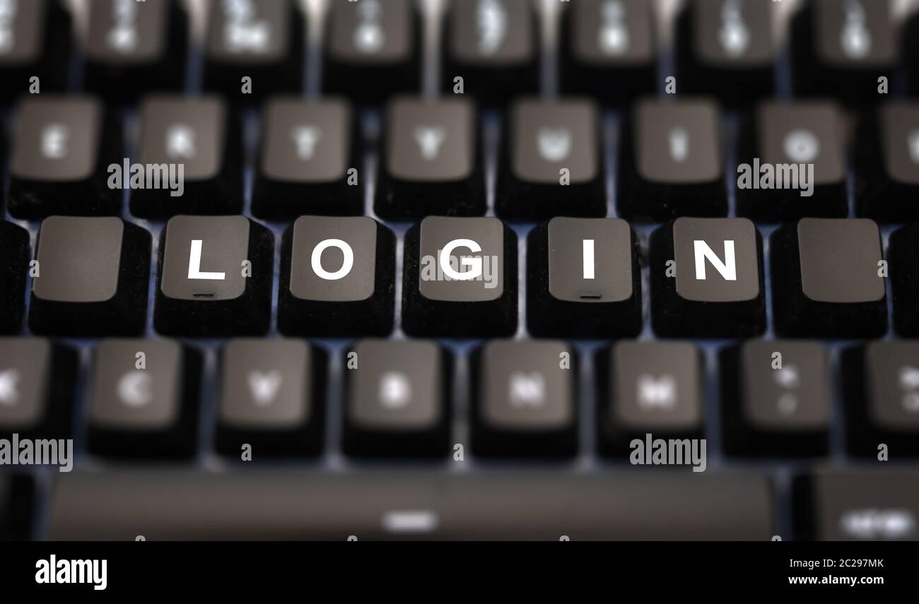 Login online concept. Login word written on keypad. Black keys with white letters message for