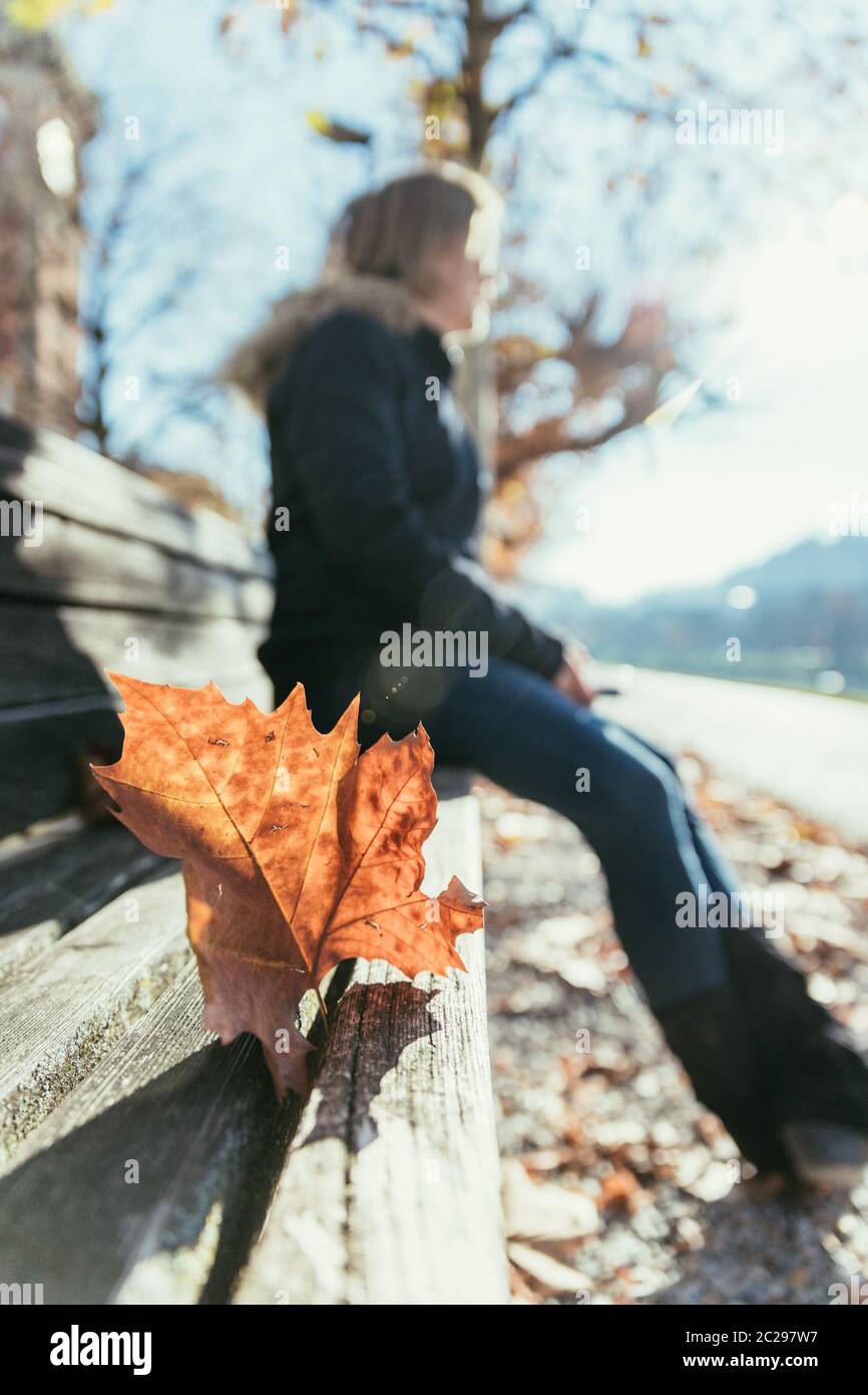 Woman park bench hi-res stock photography and images - Alamy