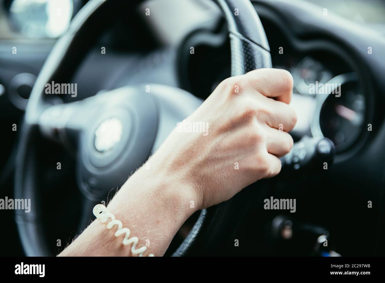 Sports car steering wheel, woman is driving Stock Photo Alamy
