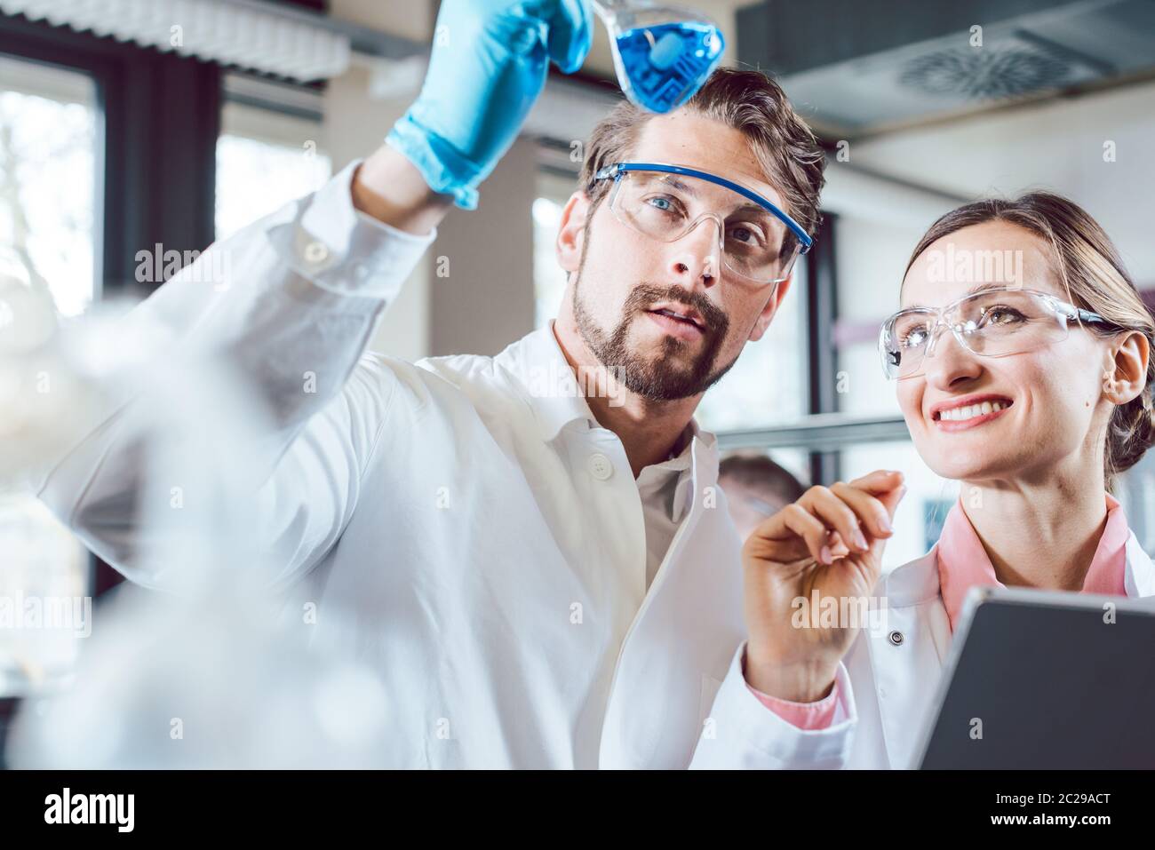 Scientists in the lab obtaining experimental data working diligently Stock Photo