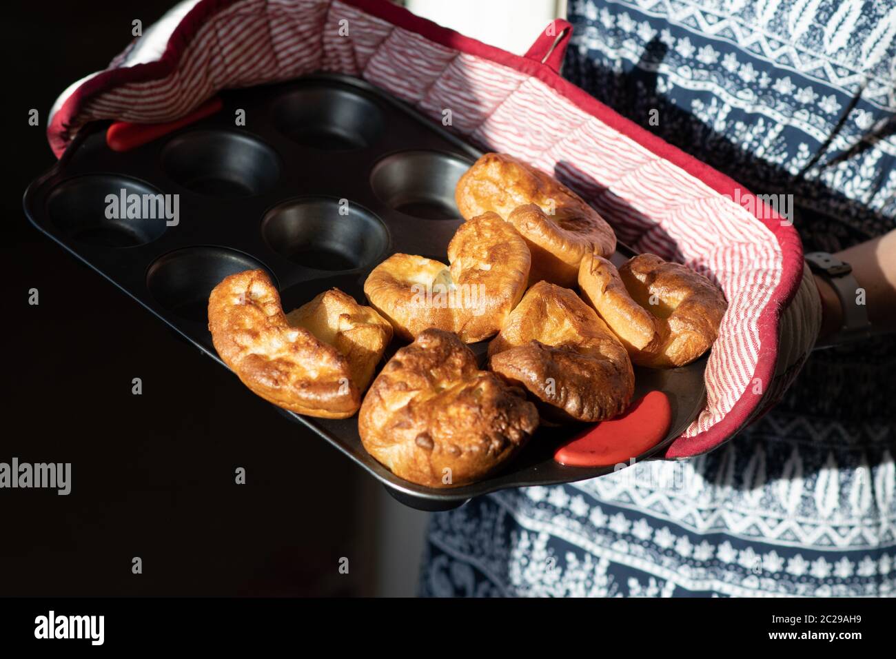 A fresh batch of traditional baked Yorkshire puddings for a Sunday roast lunch in England Stock Photo