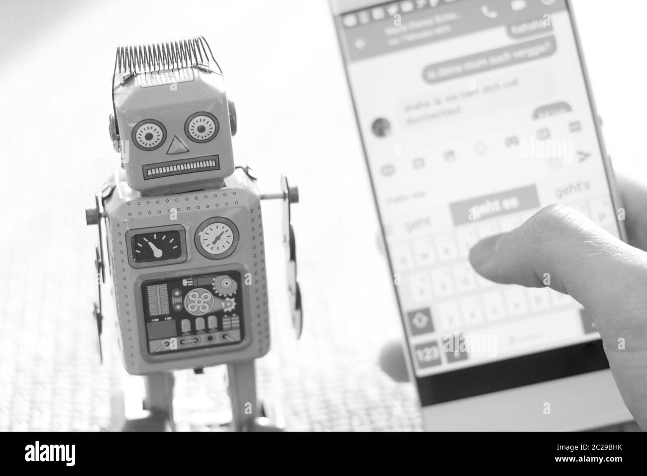 Symbol for chat bot, smartphone and messenger Stock Photo