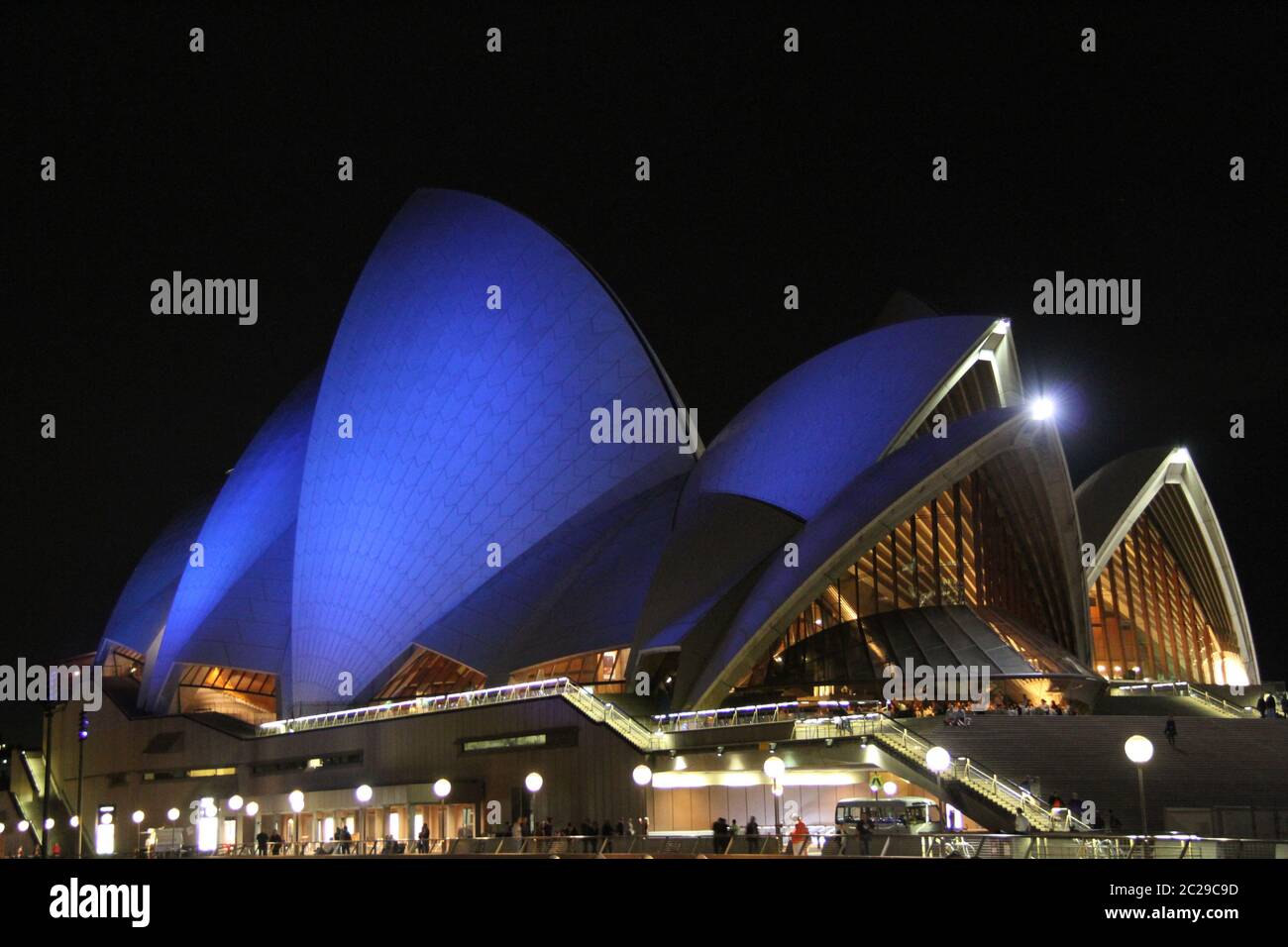 The sails of Sydney Opera House are lit up blue for Asbestos Awareness ...