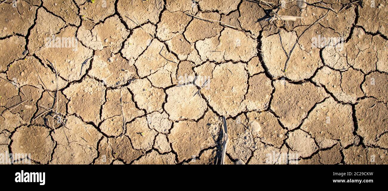 Dry cracked earth, global warming Stock Photo - Alamy