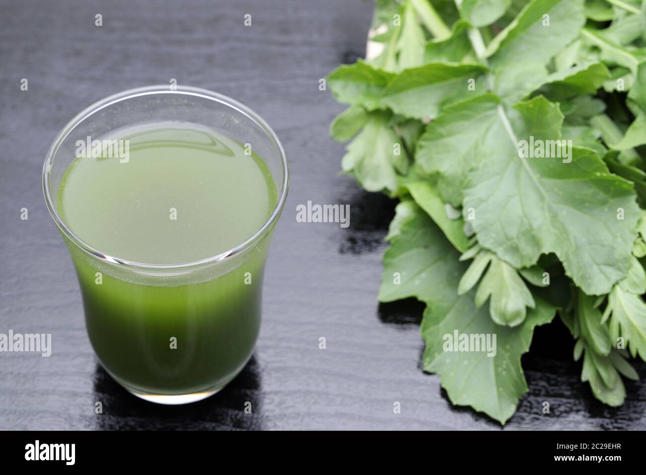 Glass of green vegetable juice, Vegetable juice called 'aojiru' in Japan Stock Photo