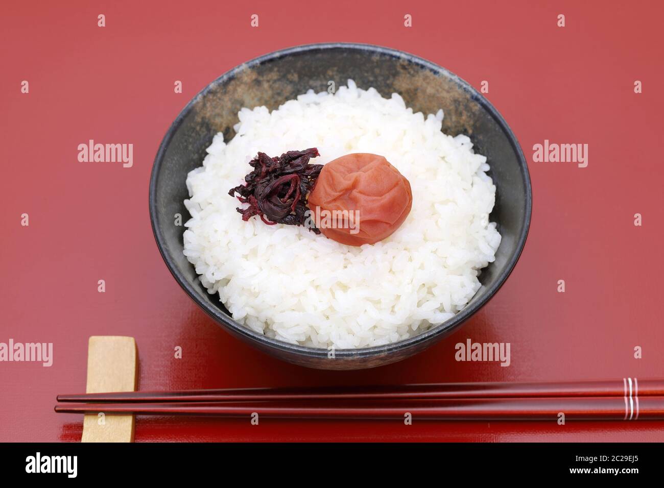 Japanese food, Umeboshi pickled salt plum on white rice Stock Photo - Alamy