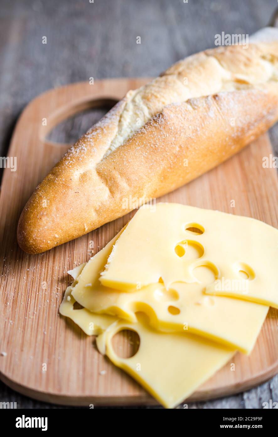 Sliced french baguette and cheese Stock Photo - Alamy