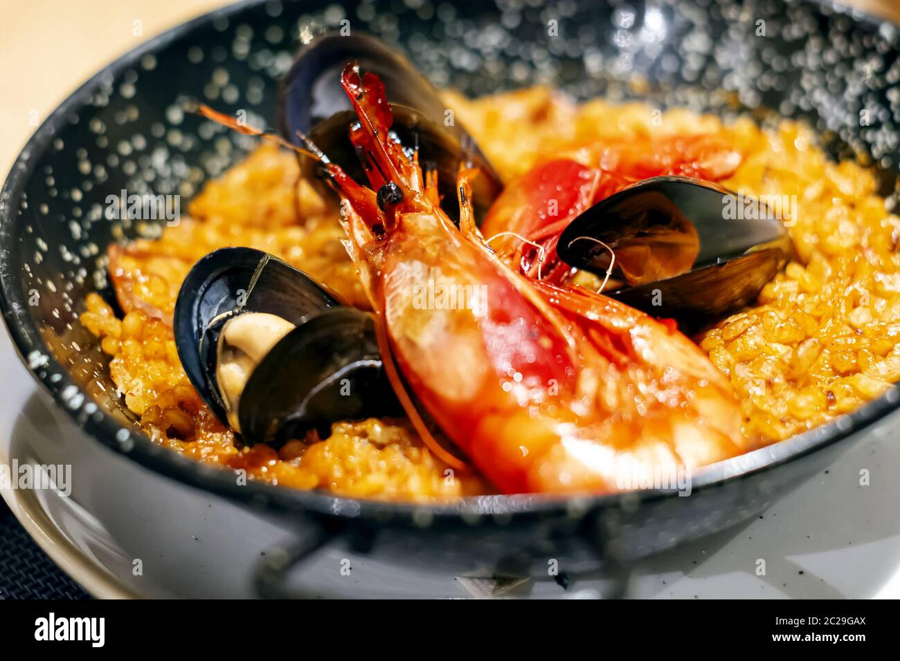 Paella with mariscos, a typical dish of traditional Spanish cuisine based on seafood and rice Stock Photo