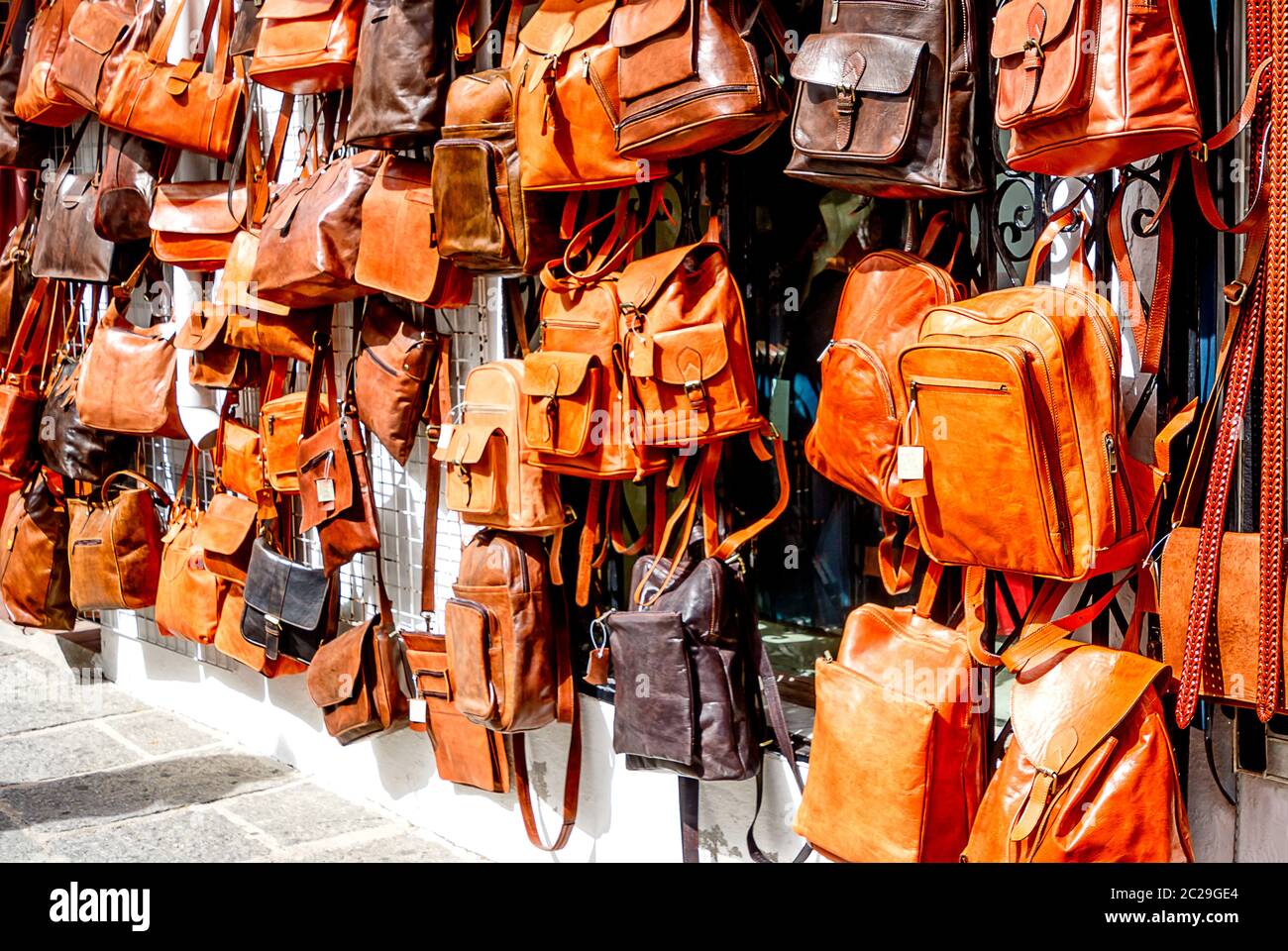 Shopping for handmade leather bags in Mijas, Andalusia, Costa del Sol, Spain Stock Photo
