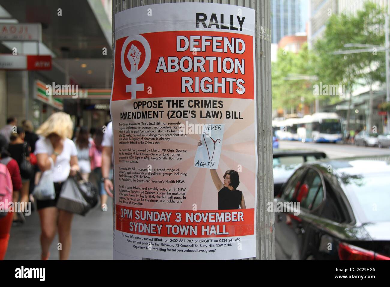 A poster attached to a lamppost on Street, Sydney promotes the