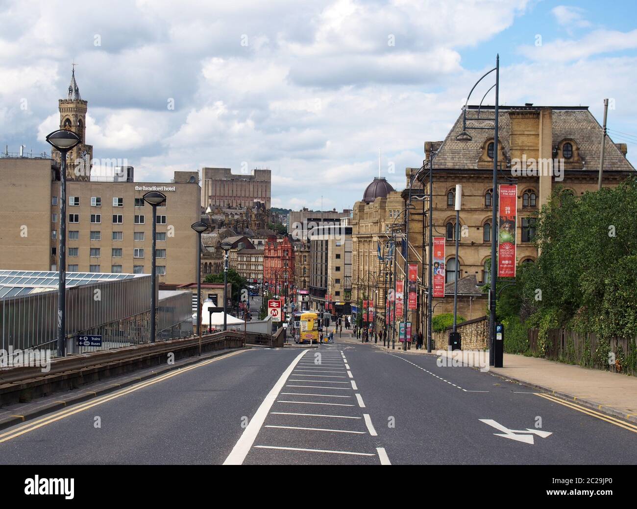 a view of bradford city center from bridge street next to the interchange with hotels and shops visible at the bottom of the roa Stock Photo