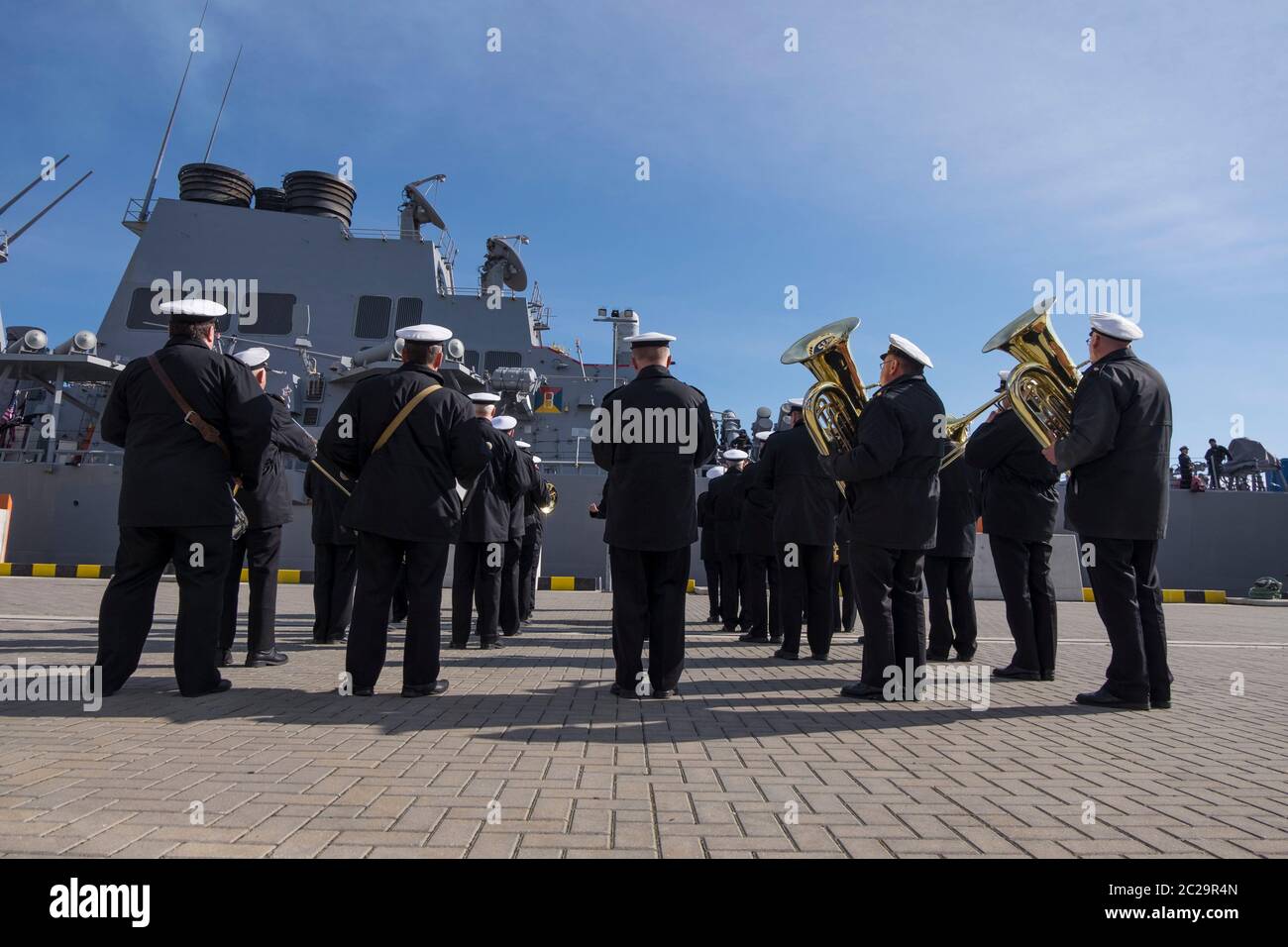 A local band welcomes the USS Navy Donald Cook for a ship visit. In Klaipėda, Lithuania. Stock Photo